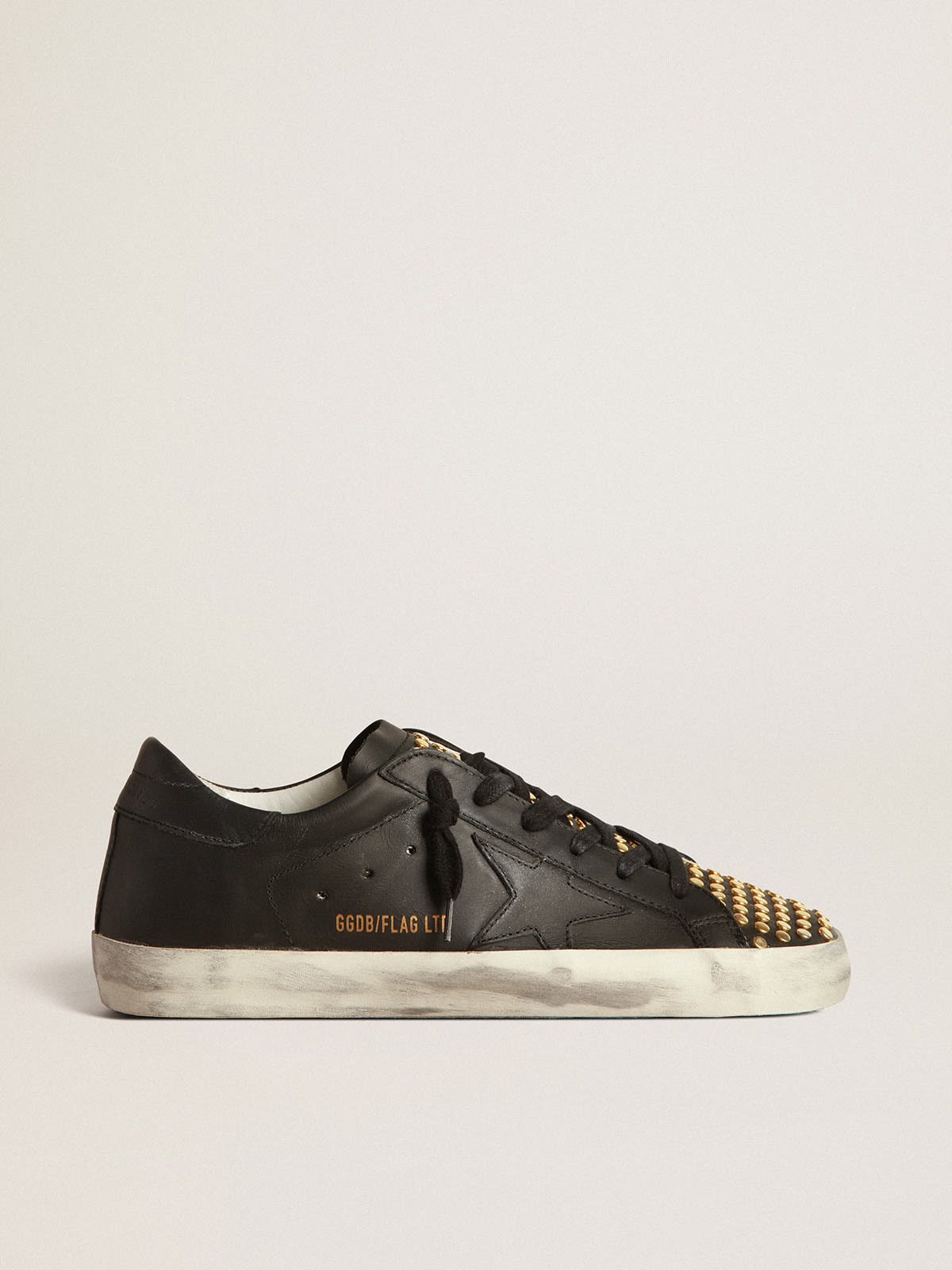 Golden Goose - Super-Star LTD sneakers in black leather with tongue with gold studs    in 