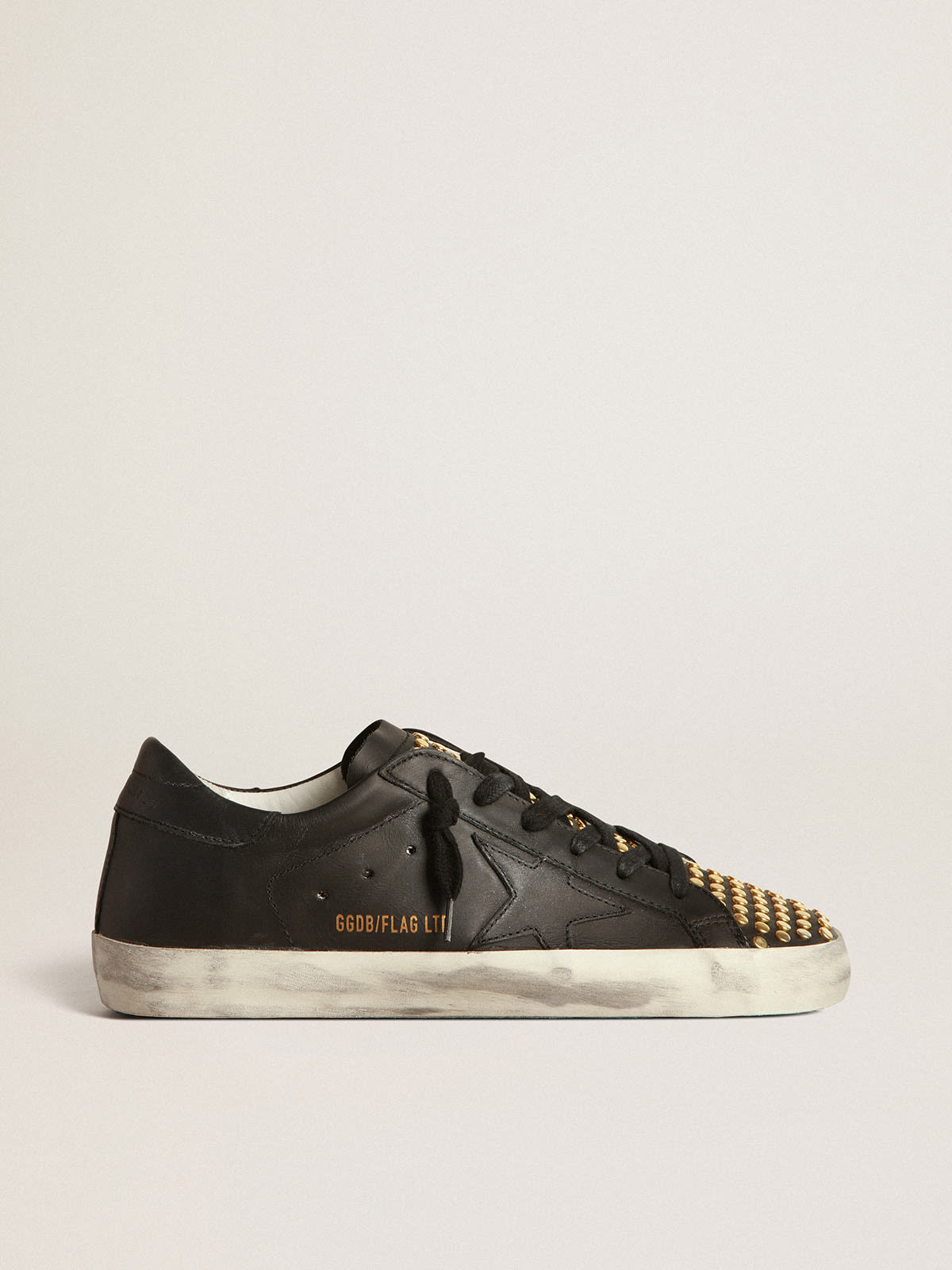 Zapatillas deportivas Super-Star LTD de piel negra con con tachas doradas | Golden Goose