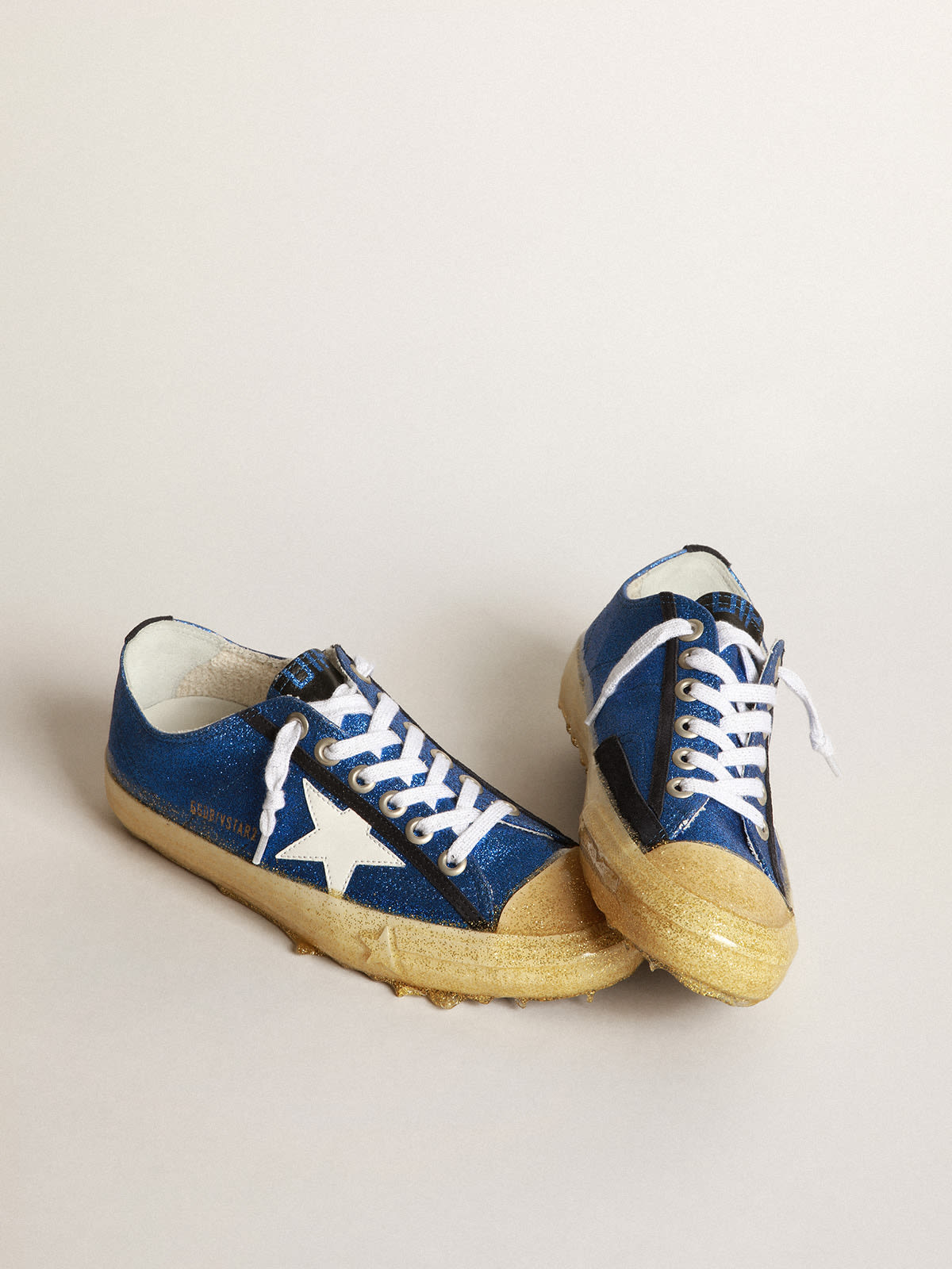 V Star sneakers in electric blue micro glitter with white patent leather star and black suede heel tab