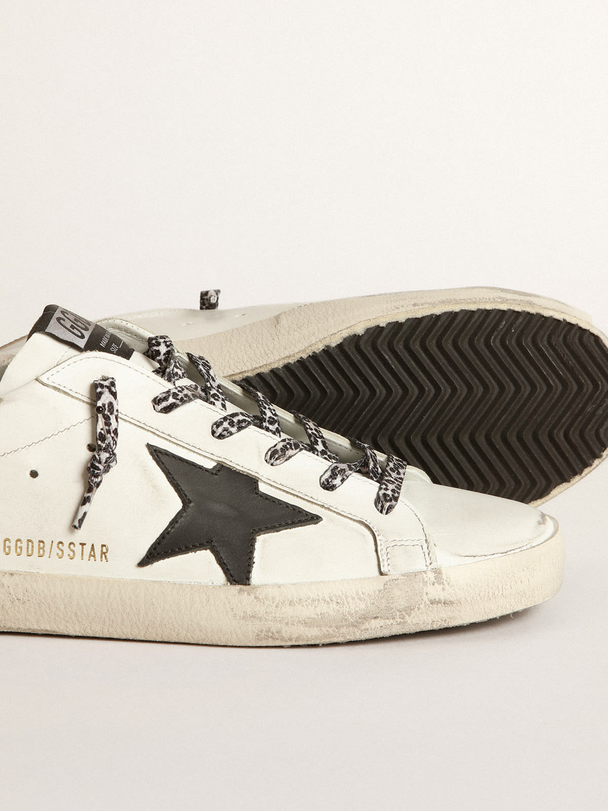 Golden Goose - White Super-Star sneakers with black star and leopard-print laces in 