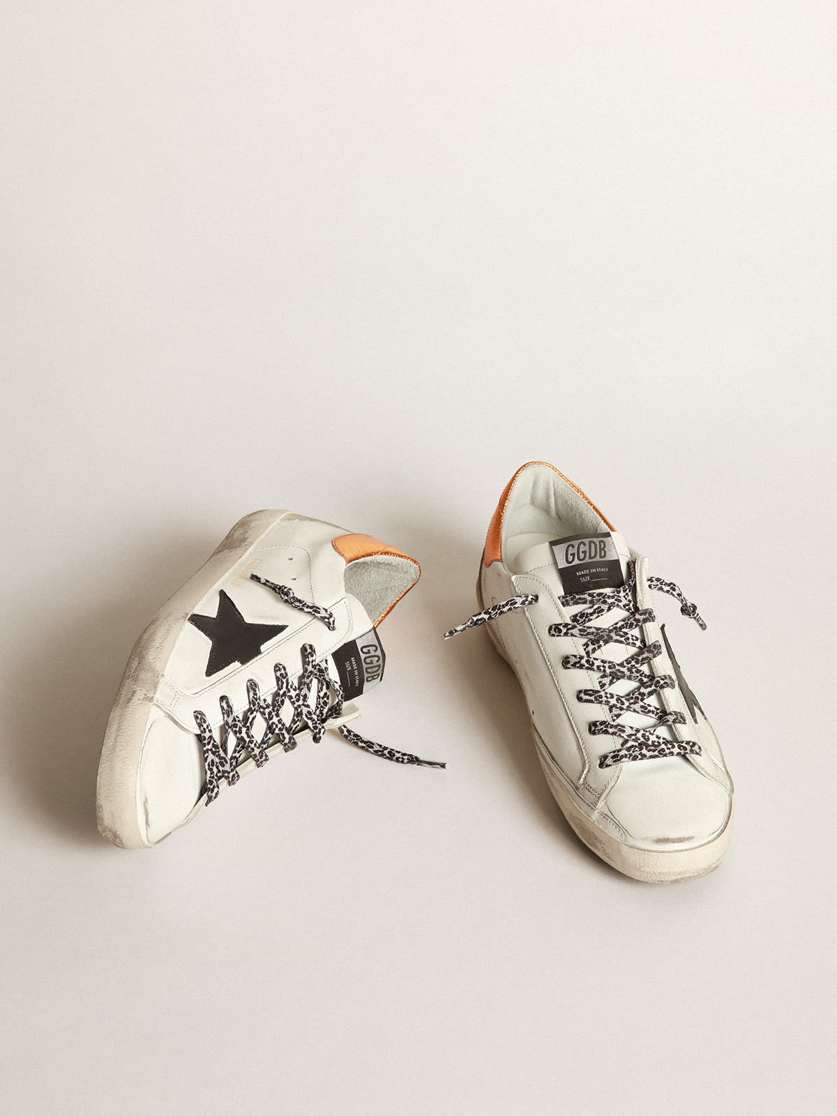 White Super-Star sneakers with black star and leopard-print laces | Golden  Goose