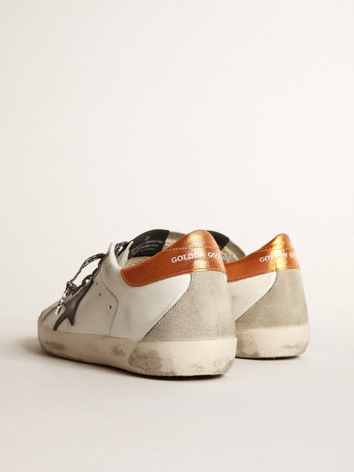 White Super-Star sneakers with black star and leopard-print laces | Golden  Goose