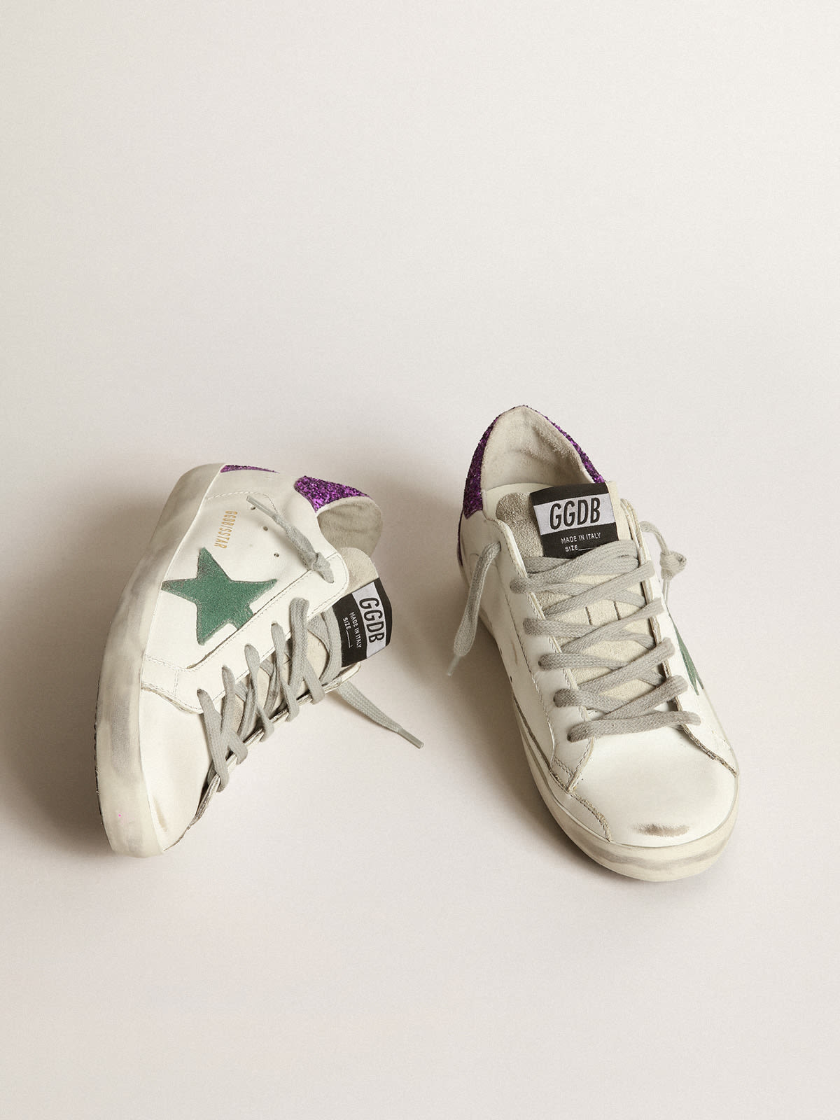 Golden Goose - White Super-Star sneakers with glittery purple rear in 