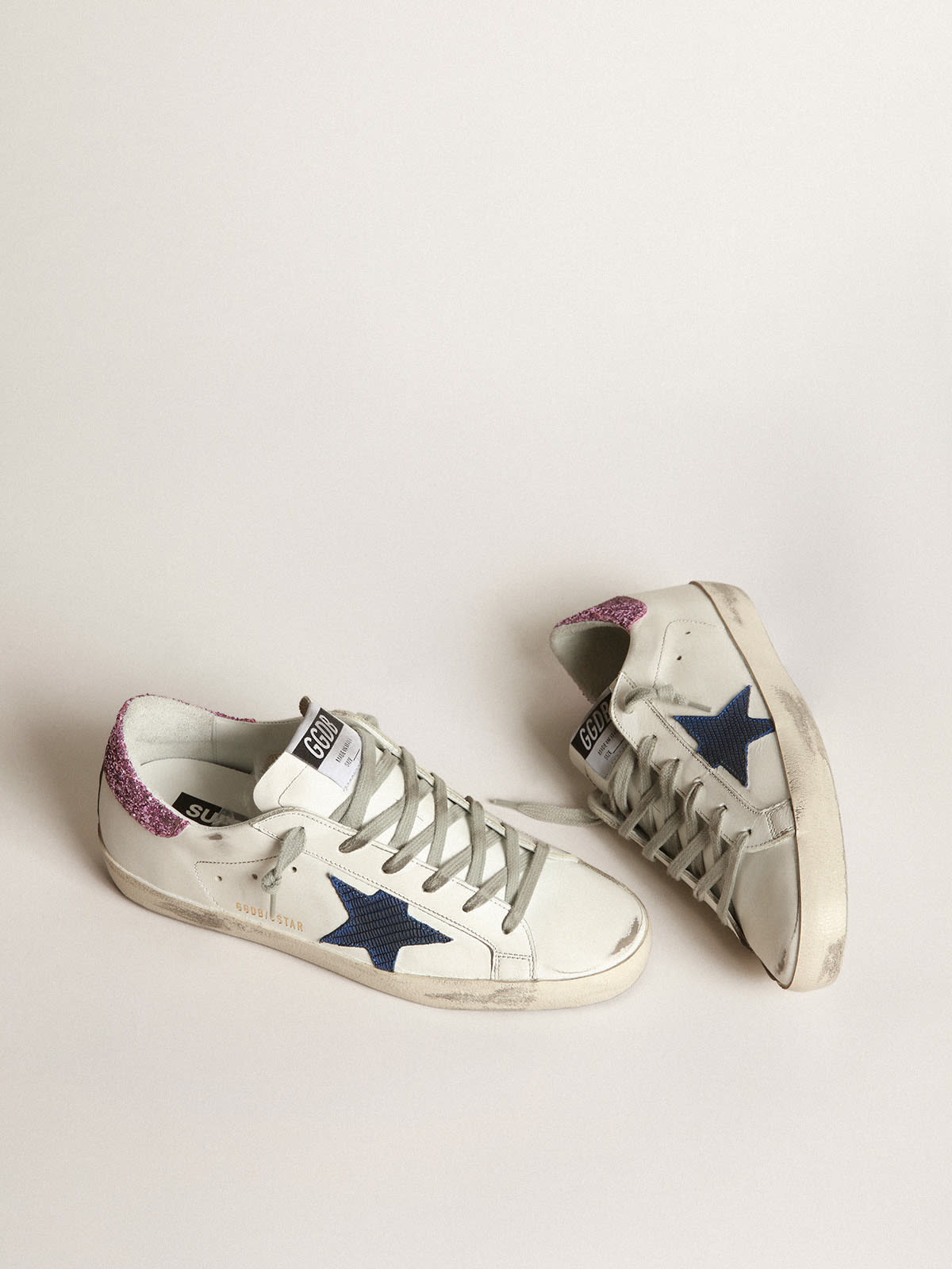 Zapatillas deportivas Super Star blancas con estrella azul y refuerzo del tal n de purpurina