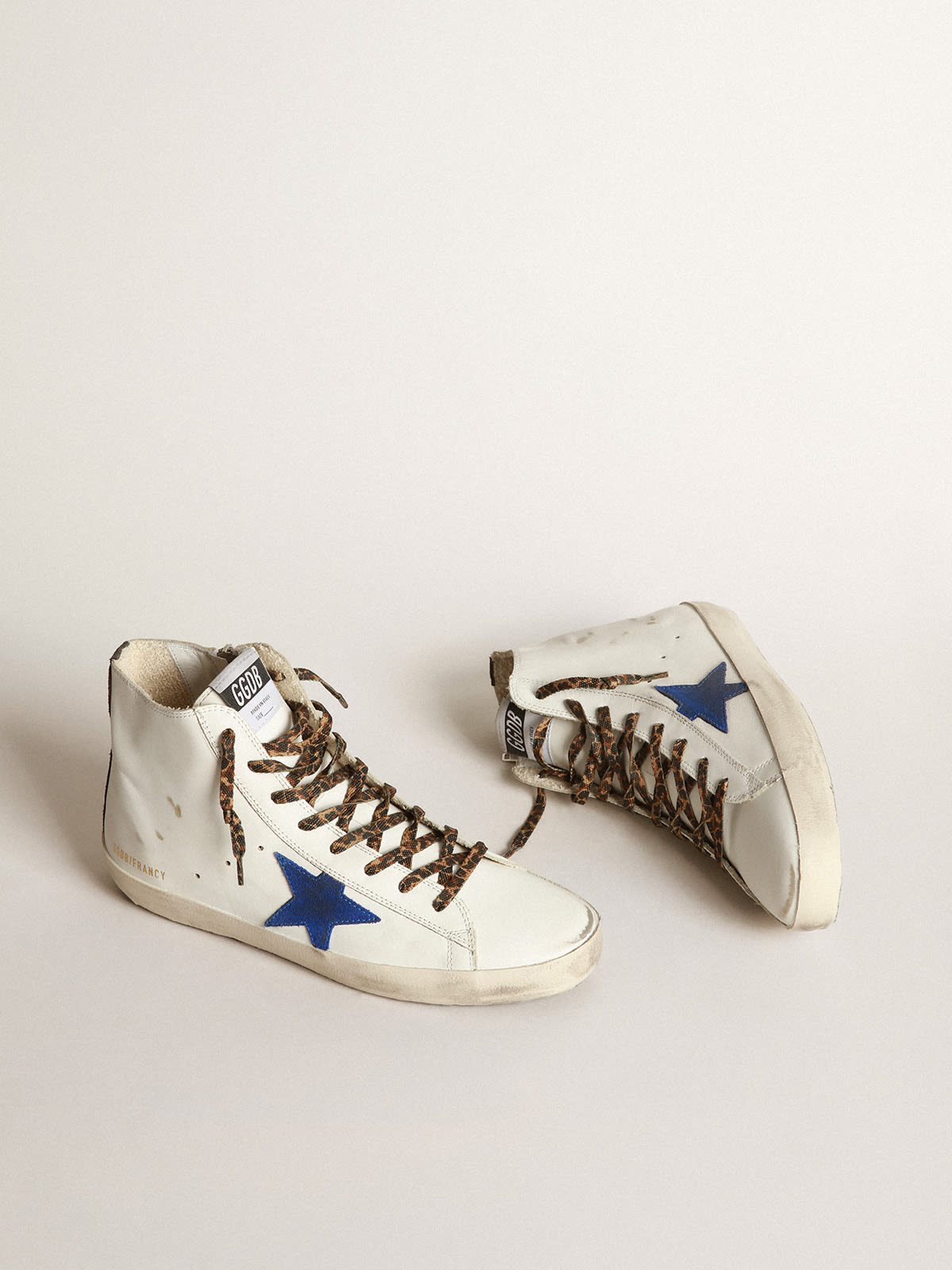 White Francy sneakers with blue star and leopard-print laces