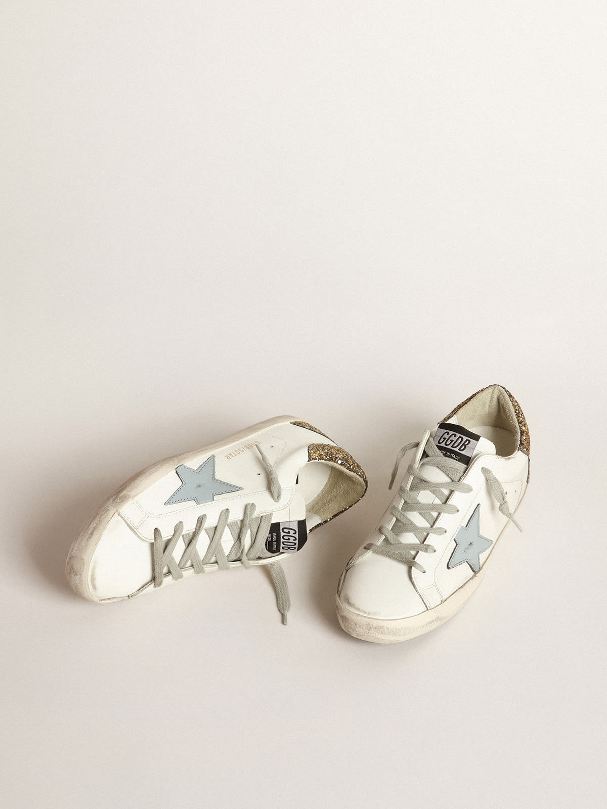 Golden Goose - Super-Star sneakers with light blue leather star and gold glitter crocodile-print heel tab in 