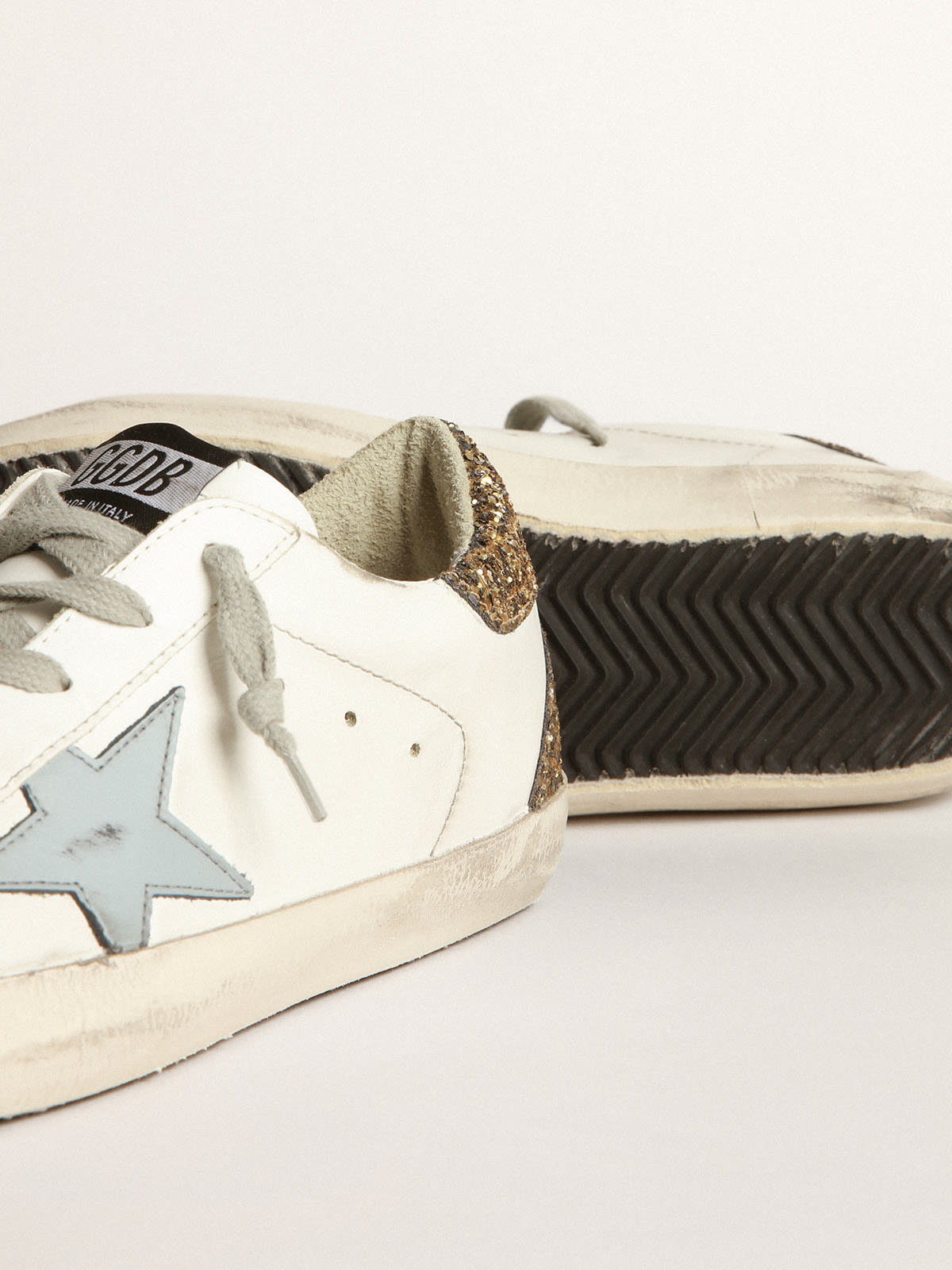 Golden Goose - Super-Star sneakers with light blue leather star and gold glitter crocodile-print heel tab in 