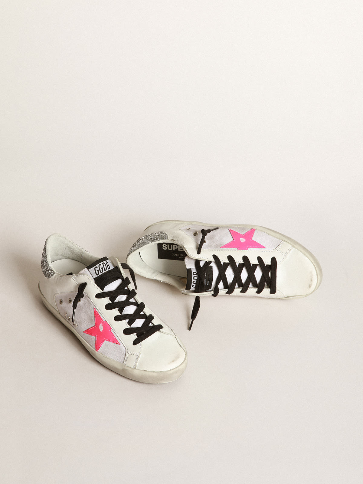 Super-Star sneakers in white leather and canvas with shocking-pink leather  star and silver glitter heel tab