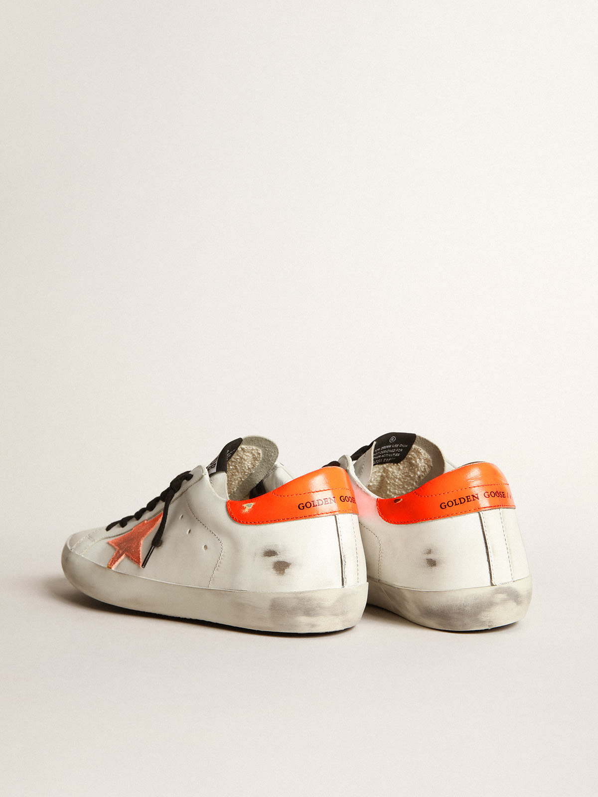 Super Star sneakers with star and fluorescent orange heel tab