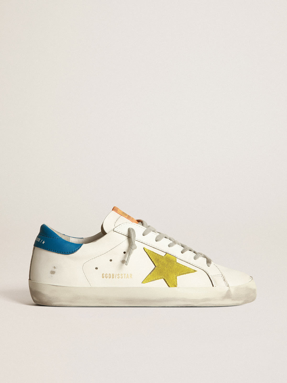 Super-Star sneakers with yellow suede star and indigo leather heel tab |  Golden Goose