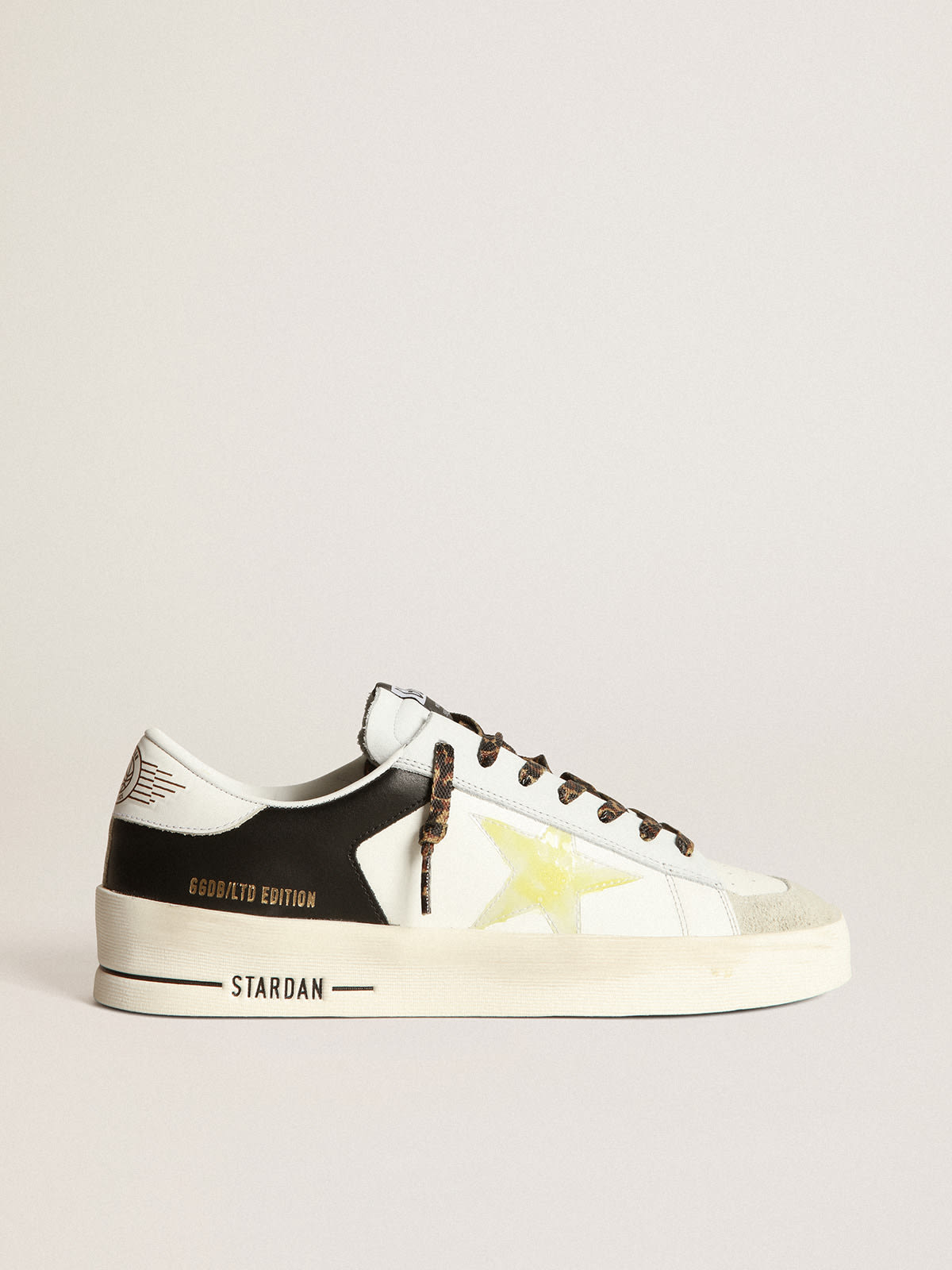 Stardan LTD sneakers in black and white leather with yellowed-effect  transparent PVC star | Golden Goose