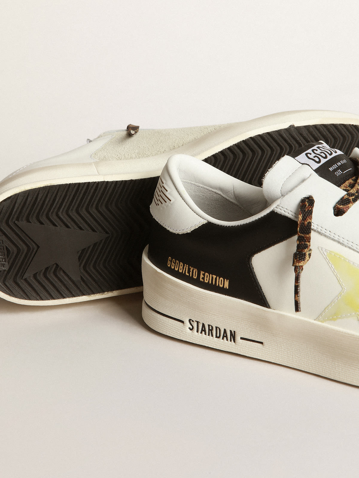 Stardan LTD sneakers in black and white leather with yellowed-effect  transparent PVC star | Golden Goose