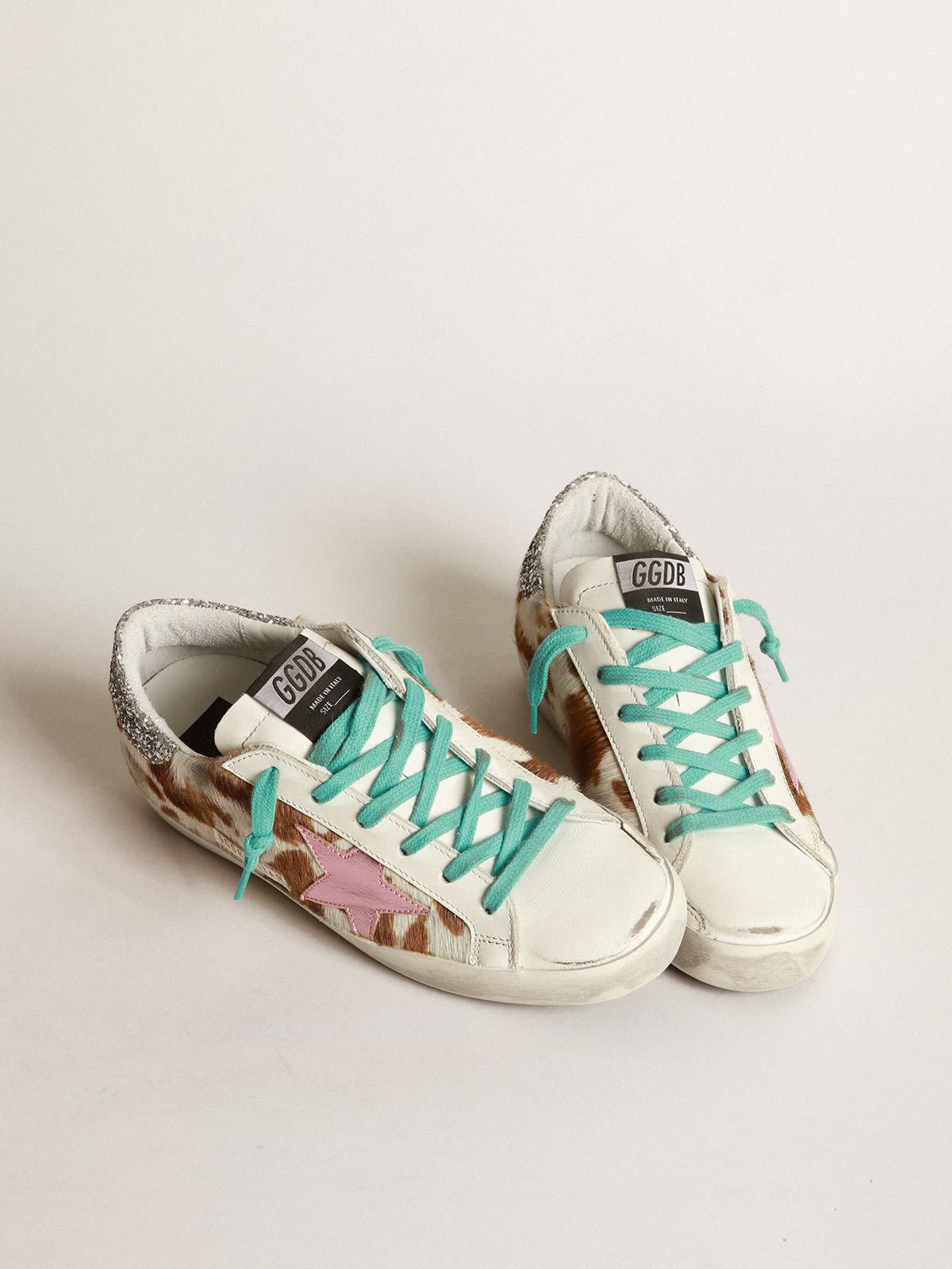 Cow-print Super-Star sneakers with glittery heel tab | Golden Goose