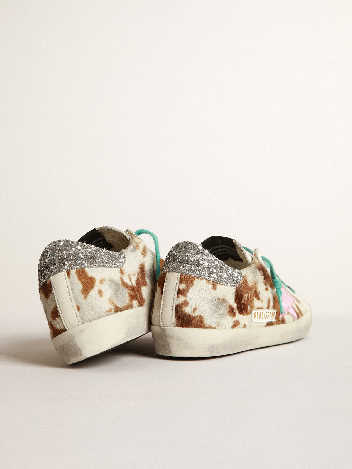 Cow-print Super-Star sneakers with glittery heel tab | Golden Goose