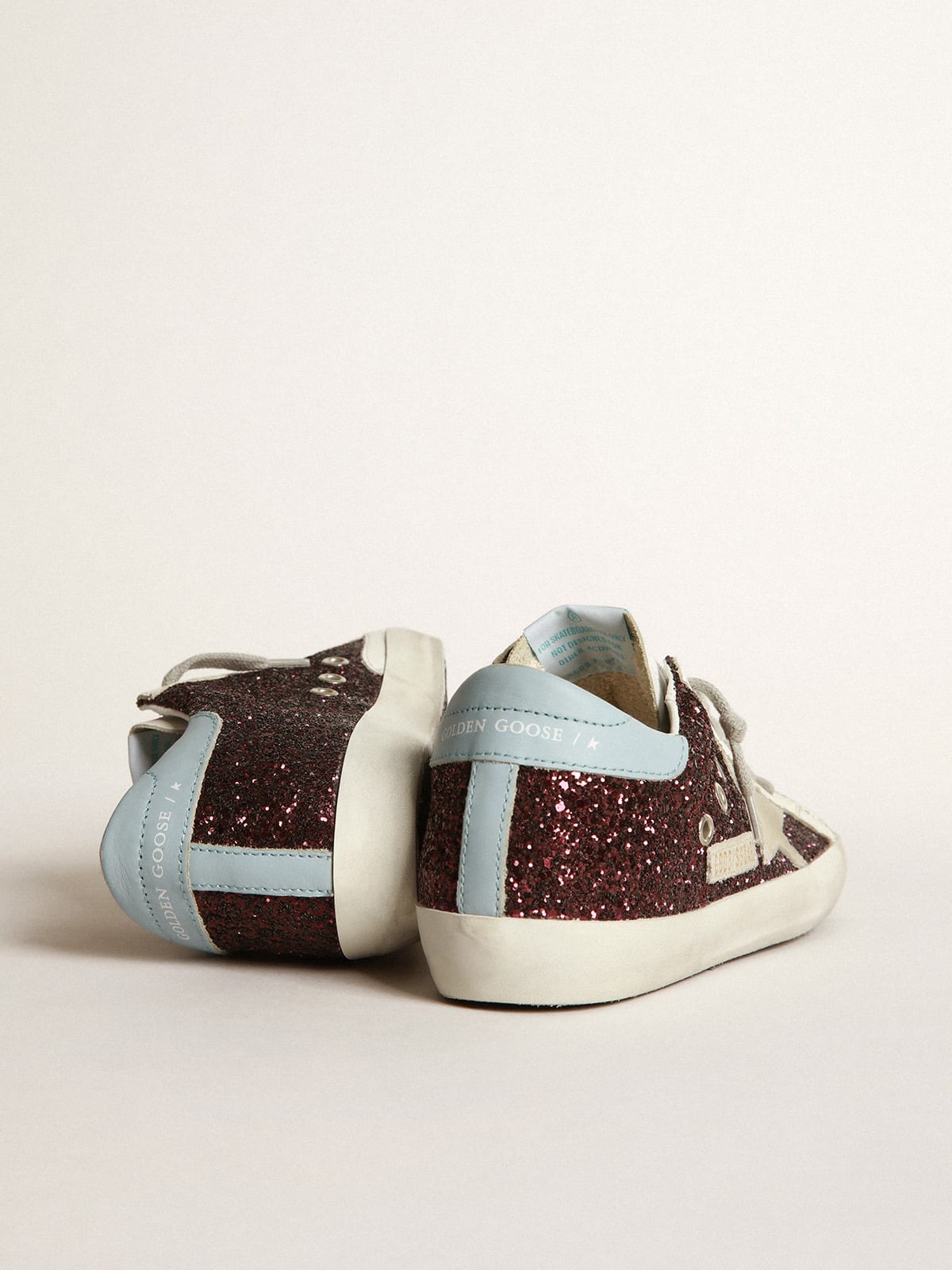 Golden Goose - Super-Star sneakers in burgundy glitter with ice-gray suede star and light blue leather heel tab in 