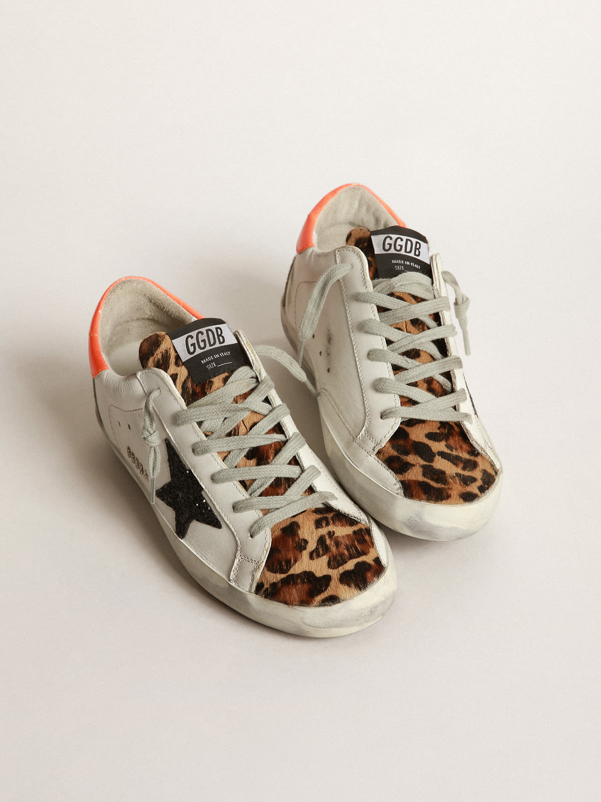 Super Star sneakers with leopard print insert glittery star and orange heel tab