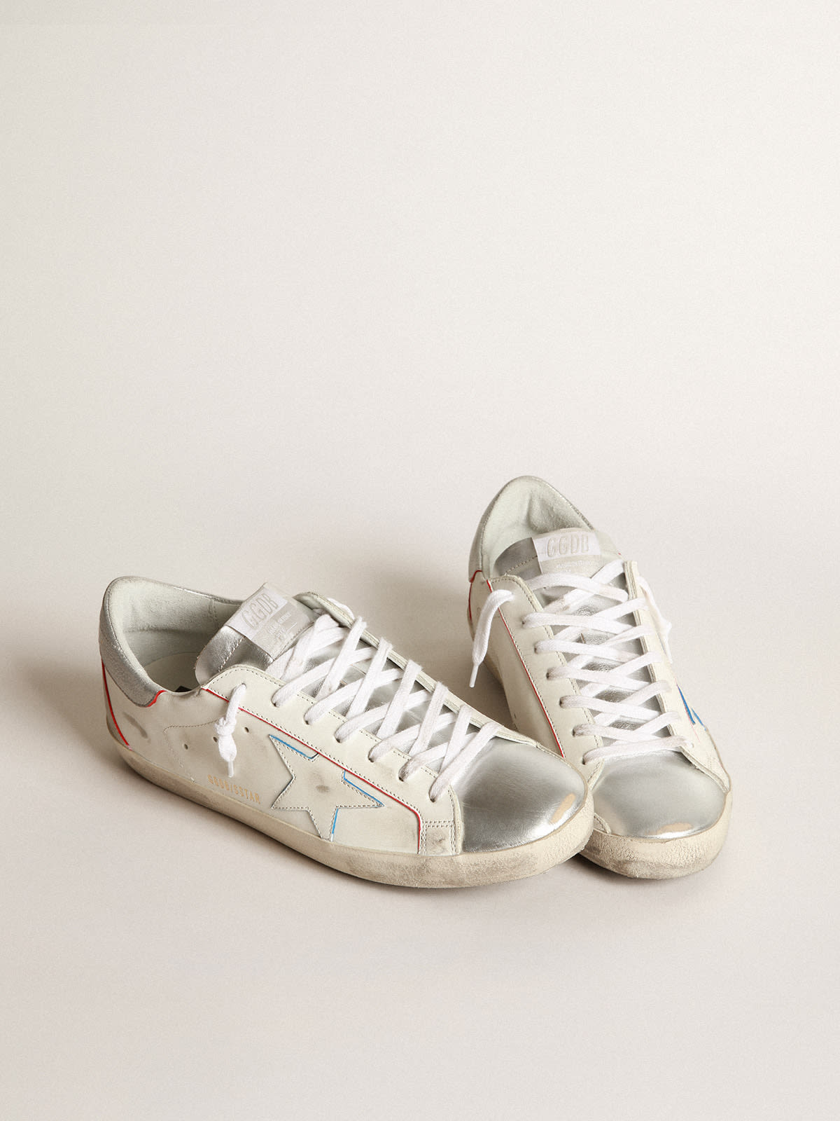 Golden Goose - Super-Star sneakers with silver laminated leather inserts and red and blue edging in 