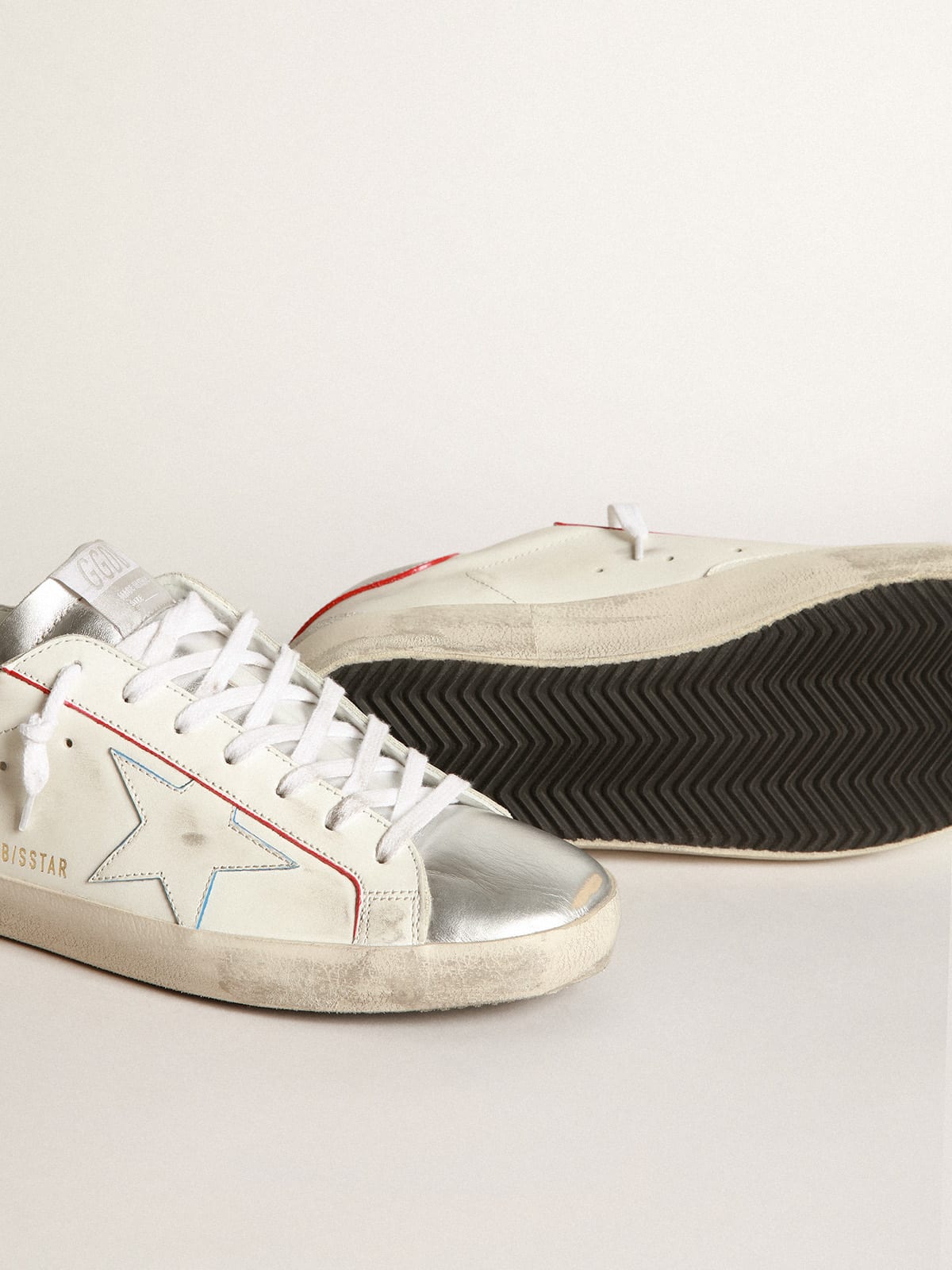 Golden Goose - Super-Star sneakers with silver laminated leather inserts and red and blue edging in 
