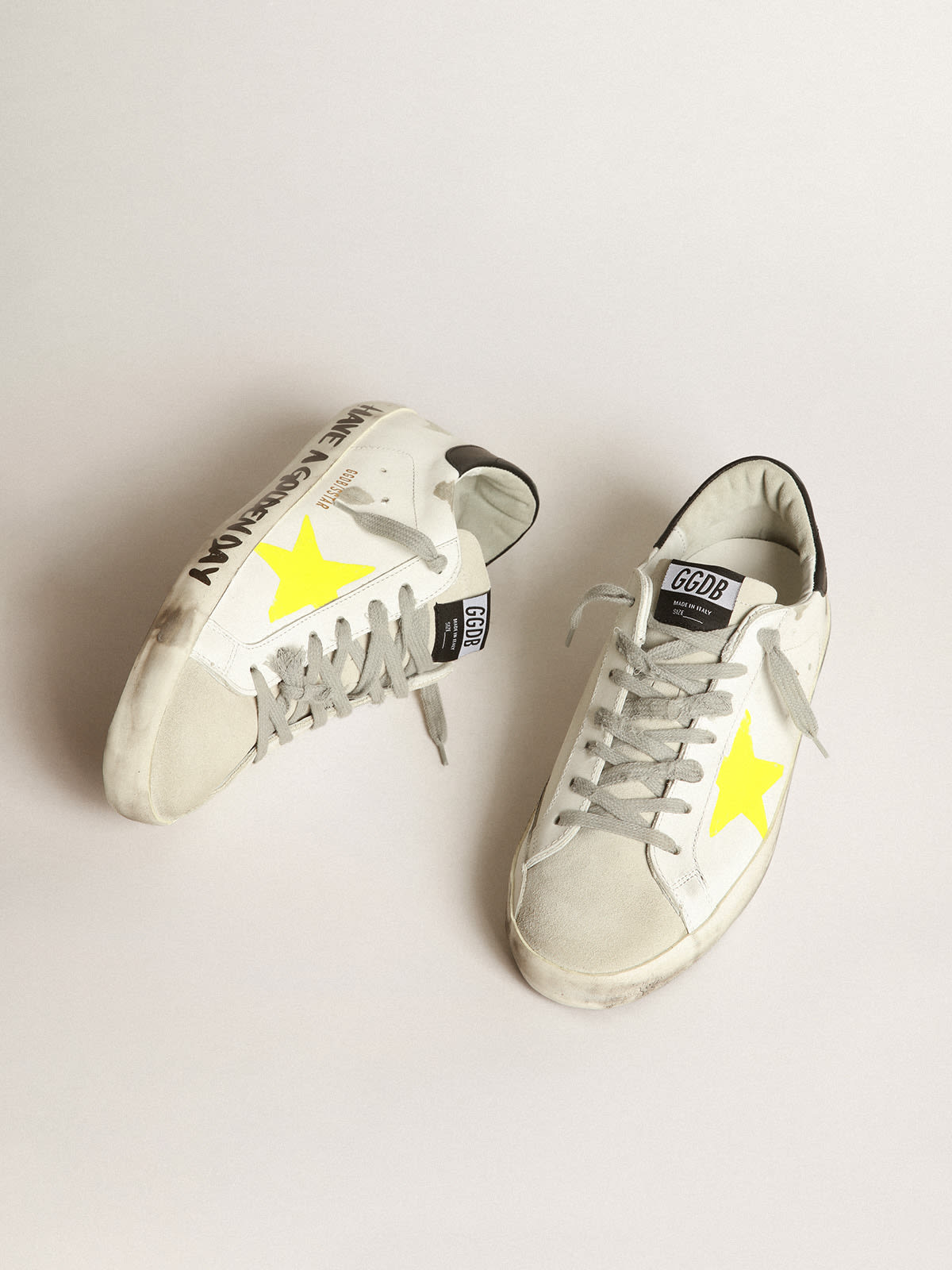 Super Star sneakers with yellow printed star and black leather heel tab