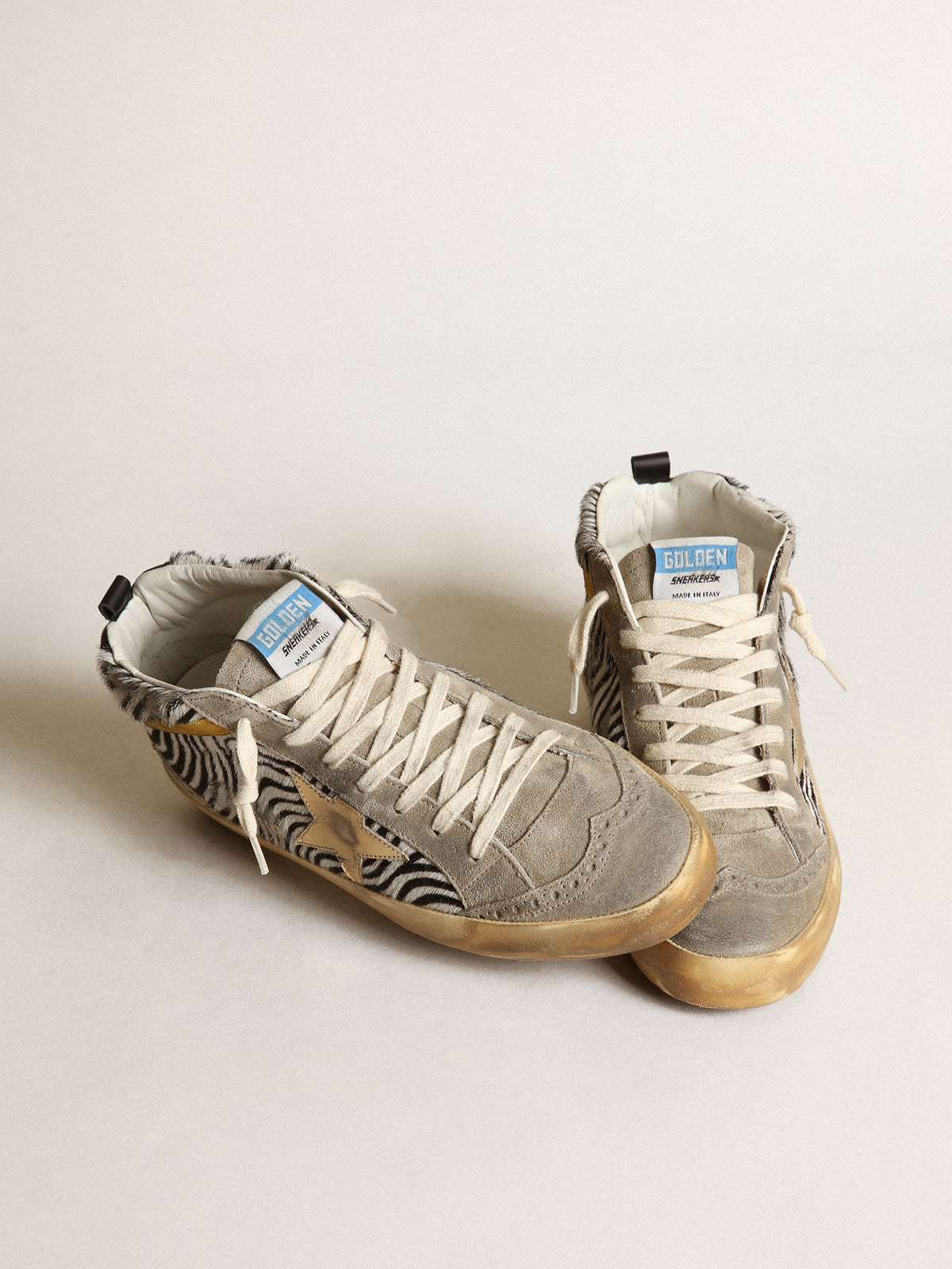 Golden Goose - Women's Mid Star in zebra print pony skin with gold leather star in 