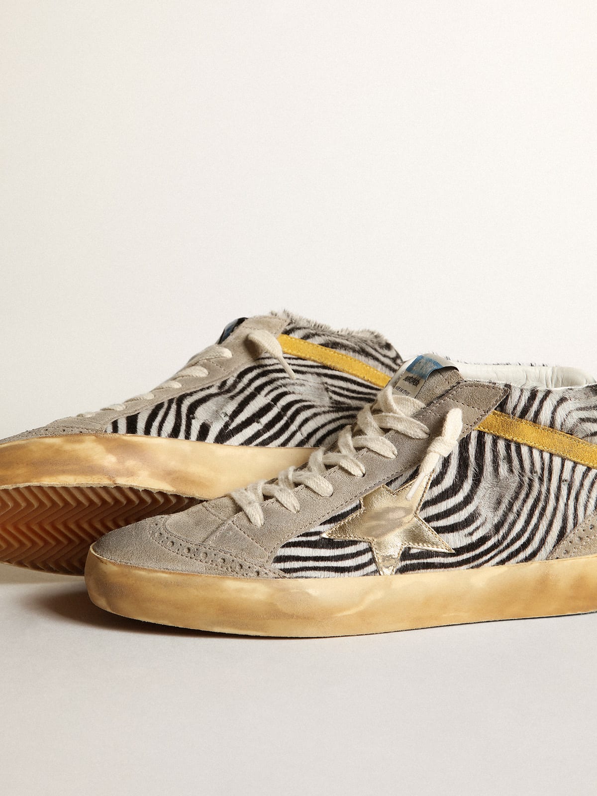 Golden Goose - Mid Star sneakers in zebra-print pony skin with gold metallic leather star and mustard-colored suede flash in 