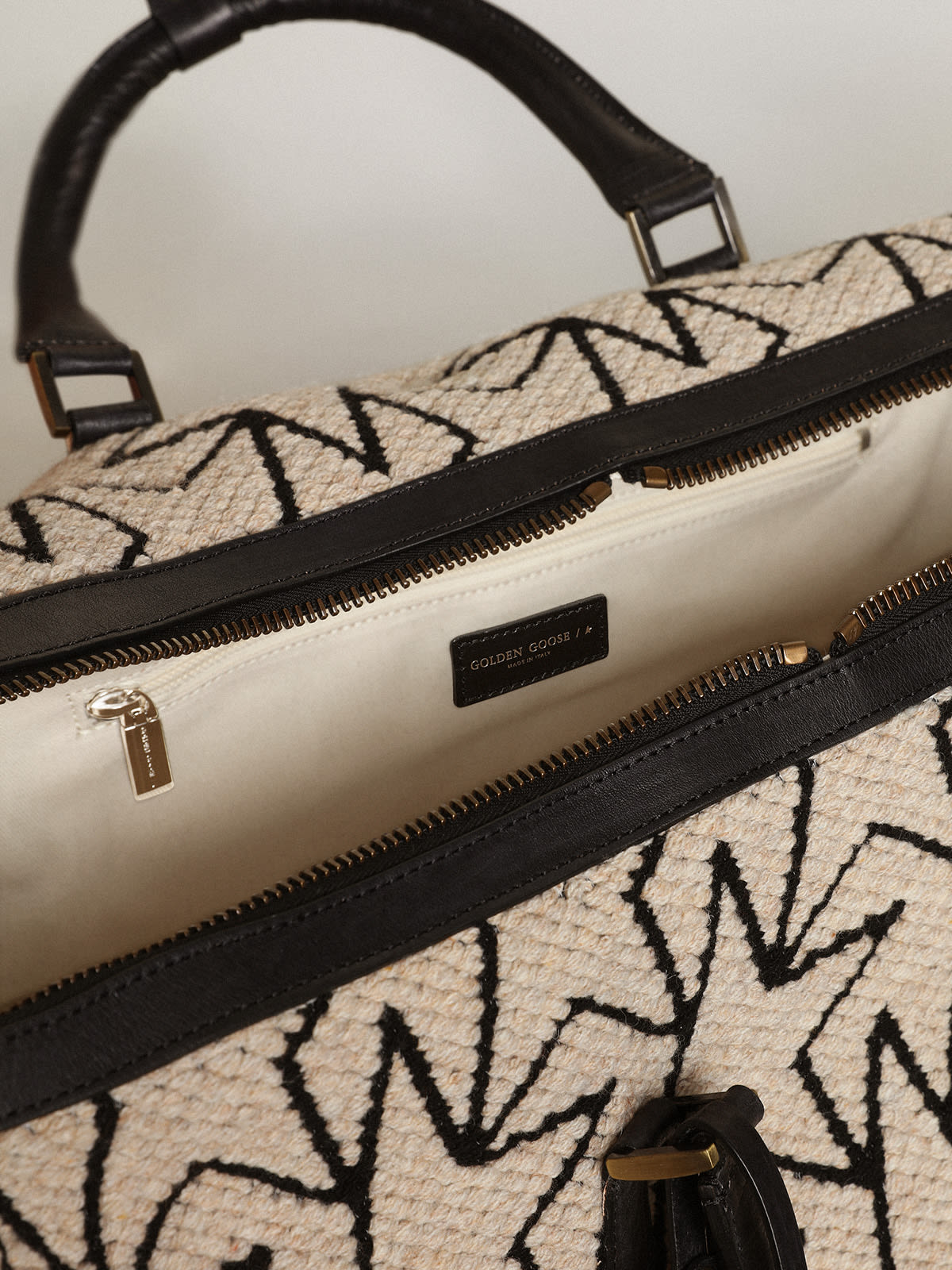 Golden Goose - Duffle bag in milk-white jacquard wool with contrasting black monograms and Golden Goose lettering in 