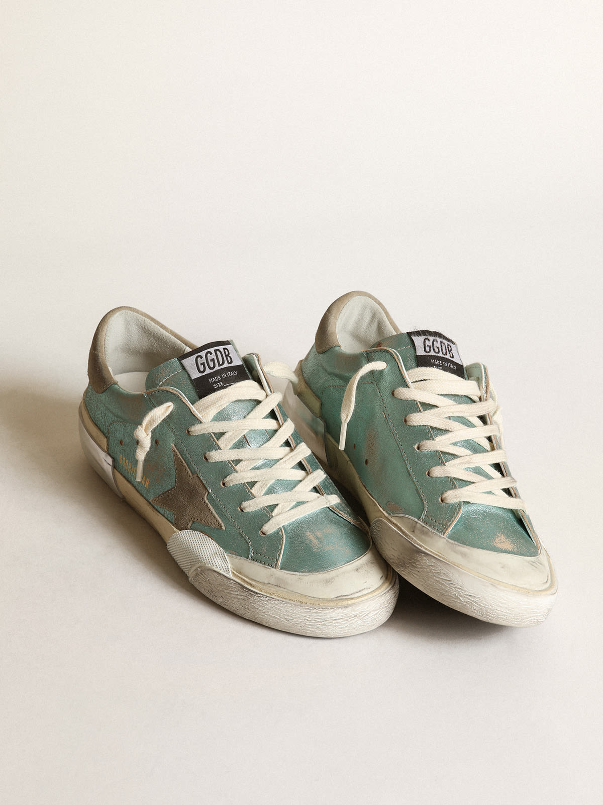 Trechter webspin temperament Lokken Super-Star sneakers in mint-green laminated leather with ice-gray suede  star and multi-foxing | Golden Goose