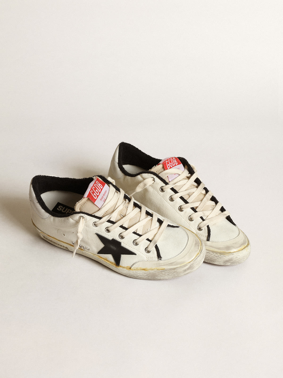 Golden Goose - Women’s Super-Star LTD sneakers in beige canvas with black leather star and white leather heel tab in 