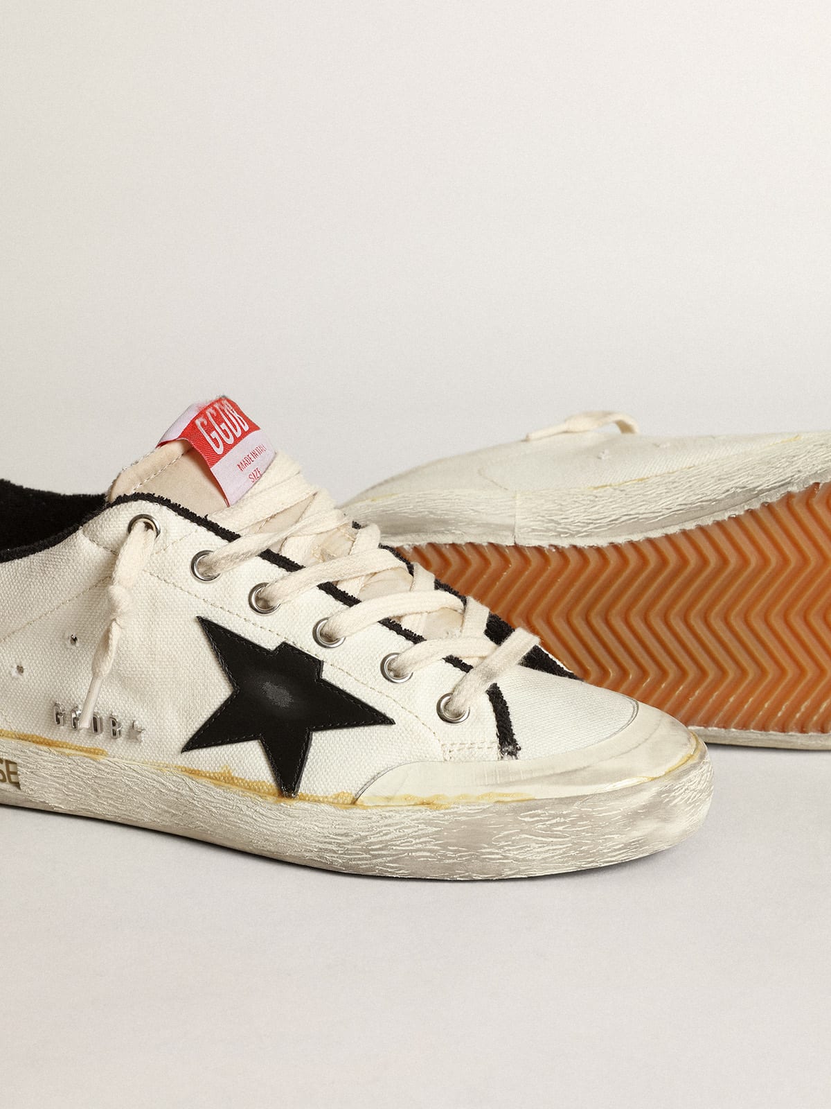 Golden Goose - Men’s Super-Star LTD sneakers in beige canvas with black leather star and white leather heel tab in 