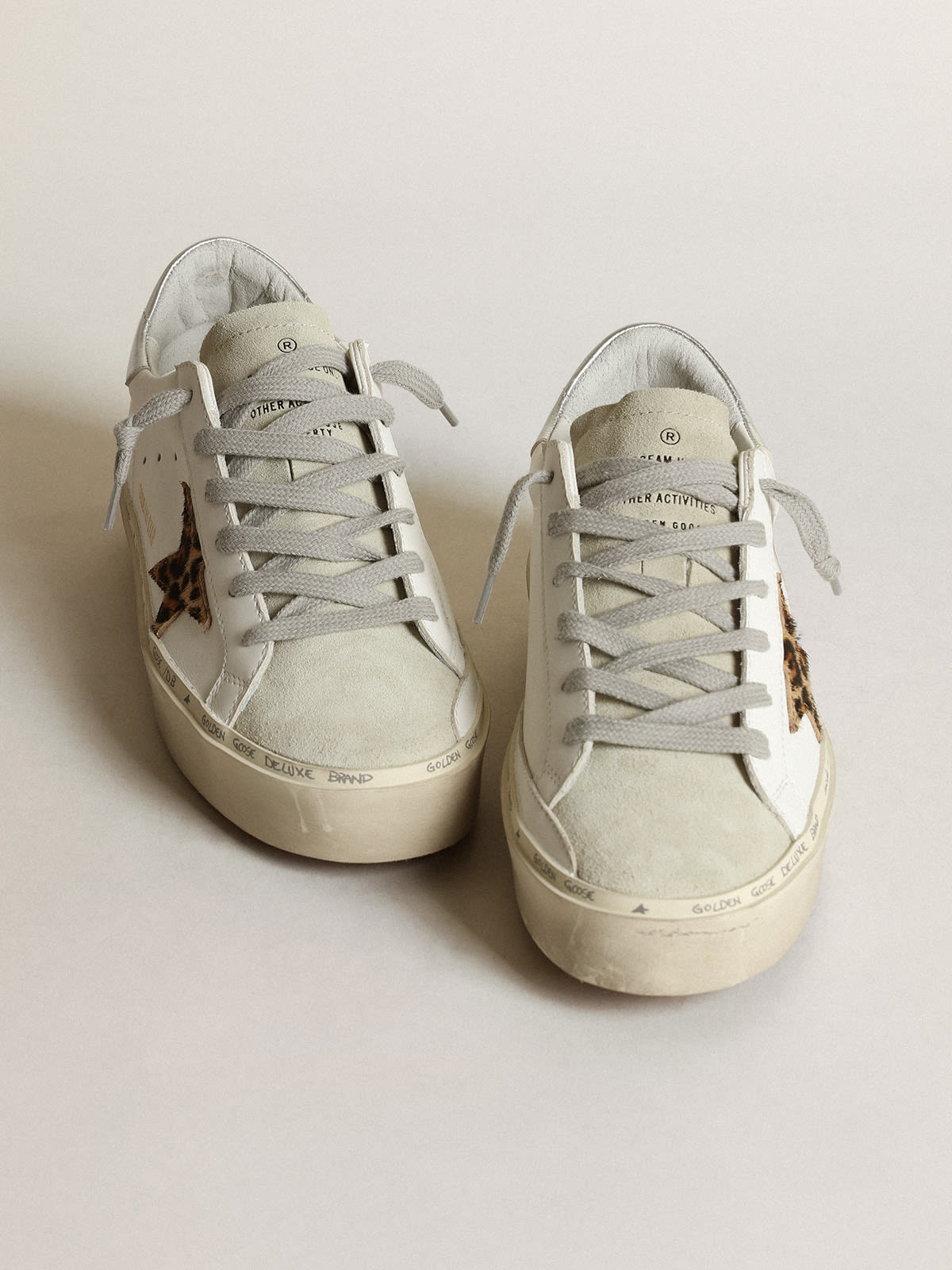 Golden Goose - Hi Star sneakers with leopard-print pony skin star and silver metallic leather heel tab in 