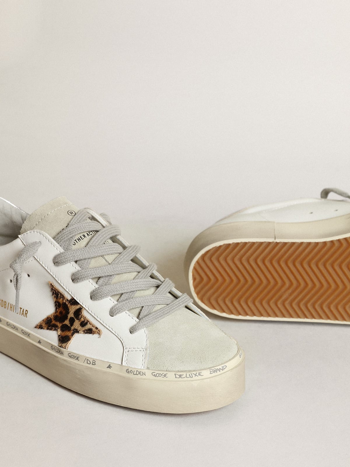 Golden Goose - Hi Star sneakers with leopard-print pony skin star and silver metallic leather heel tab in 