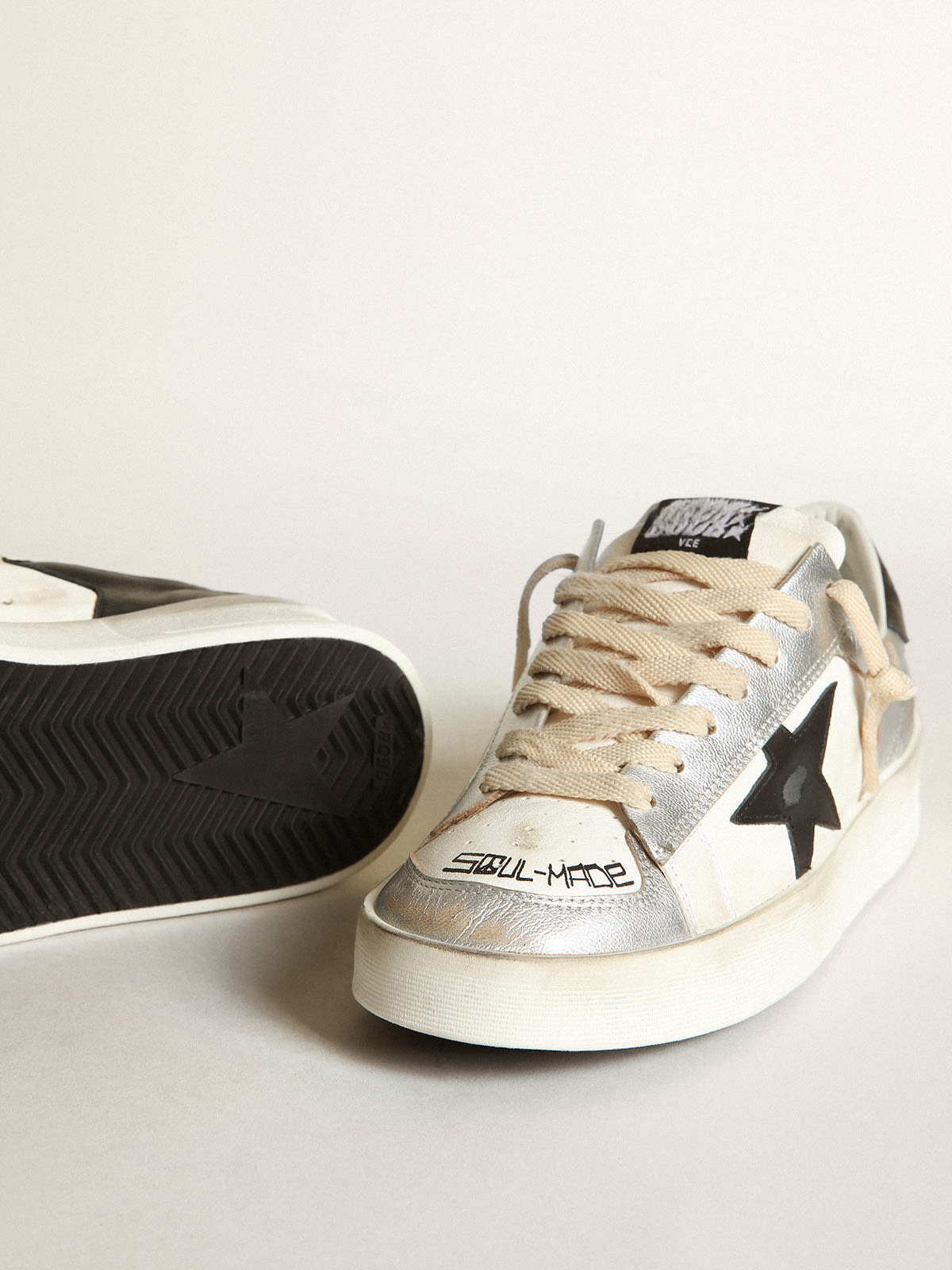 Golden Goose - Women’s Stardan sneakers in silver laminated leather with white nappa leather inserts and a black leather star in 