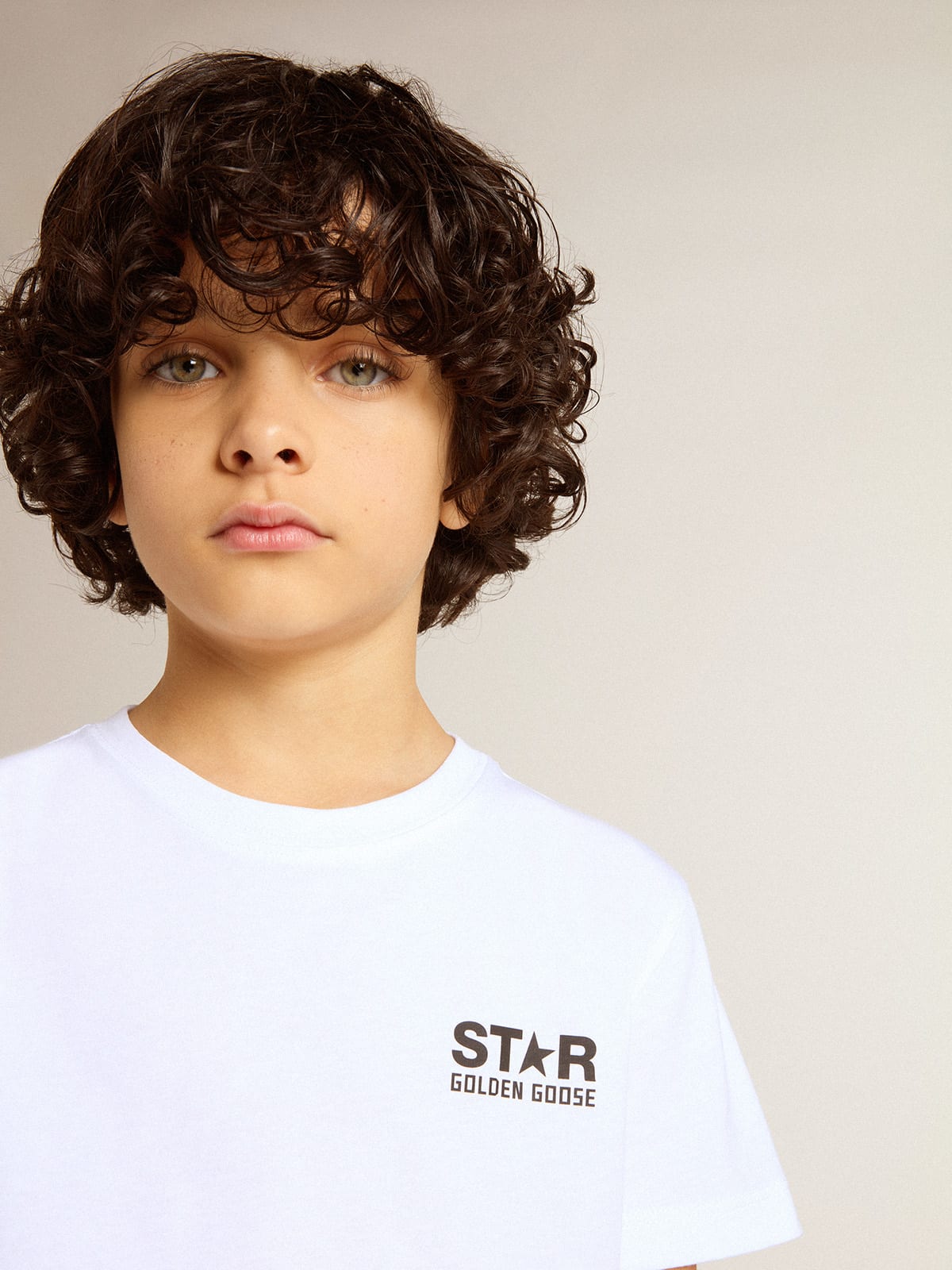 White T-shirt with contrasting black logo and star