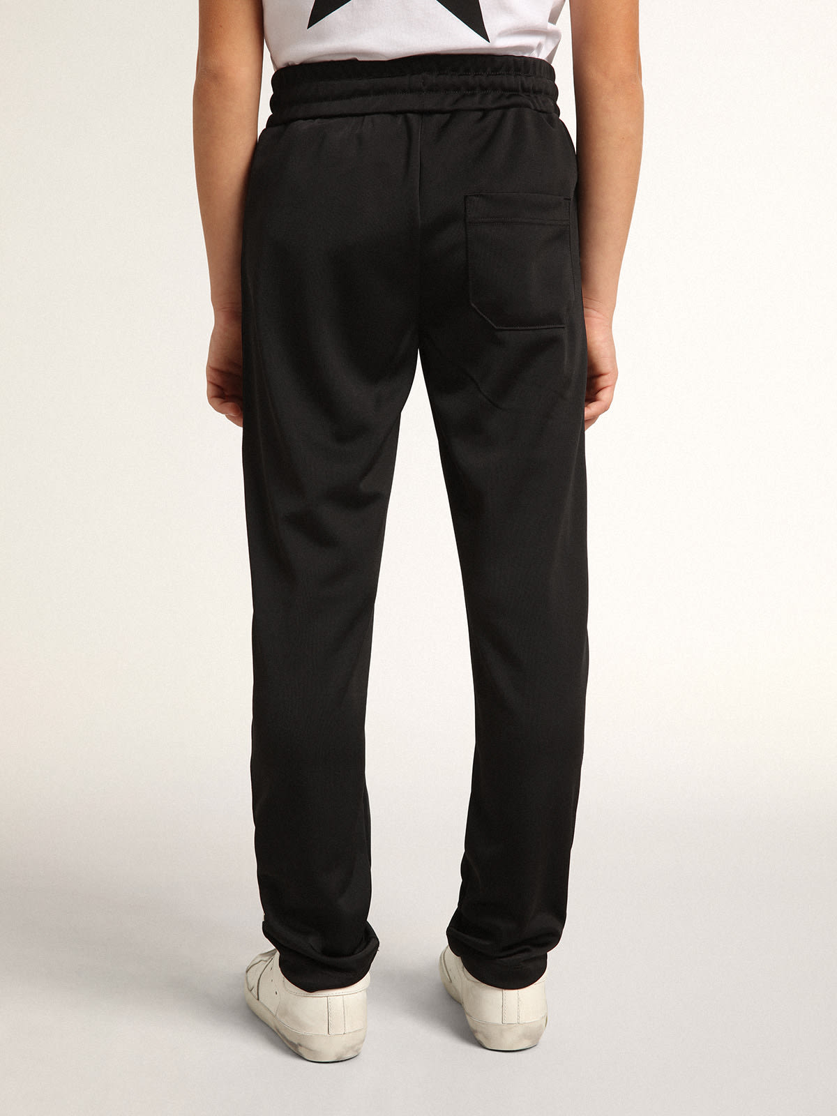 Pantalon noir outlet avec couture blanche