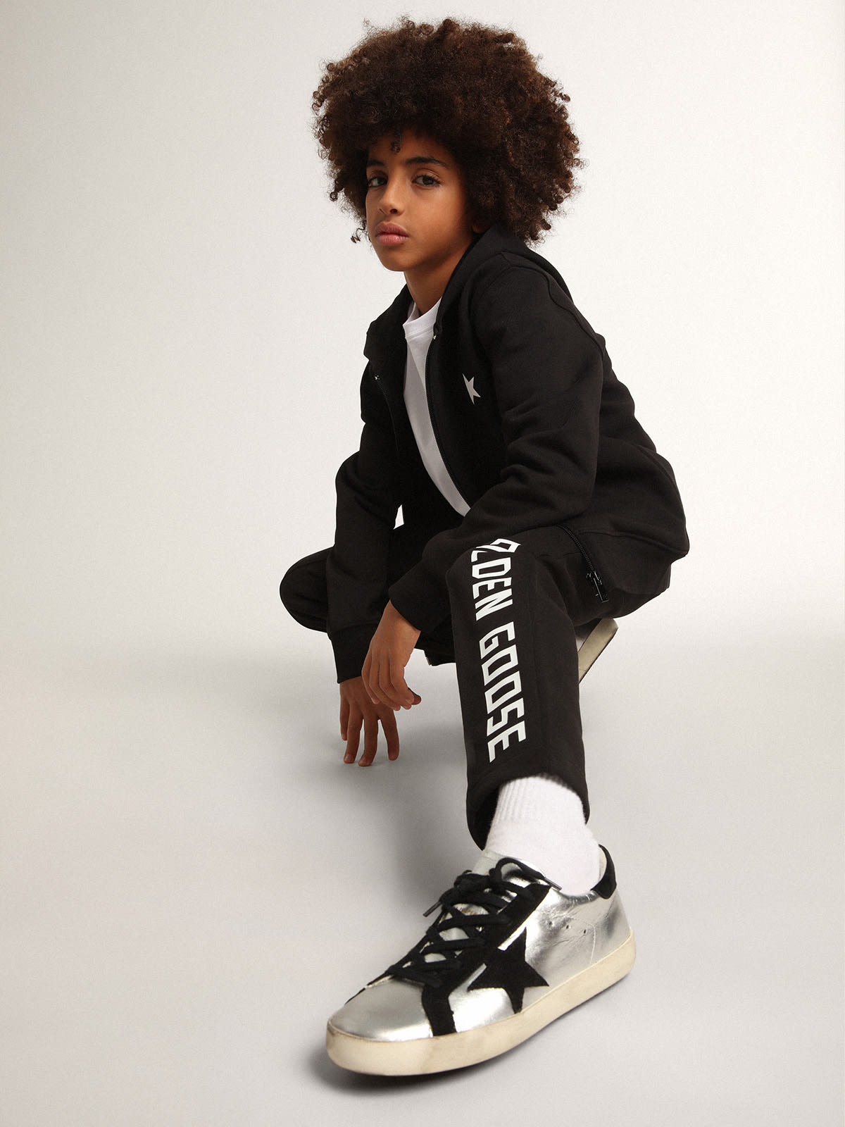 Black hooded sweatshirt with contrasting white star and logo | Golden Goose