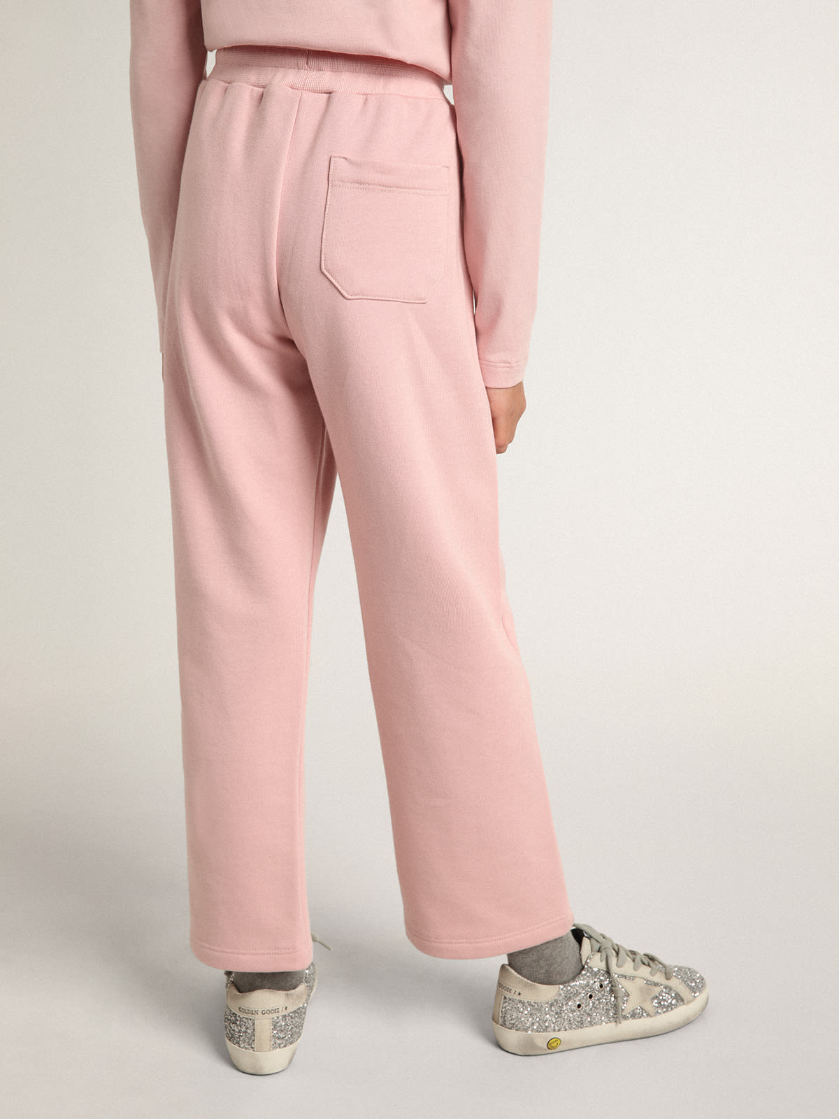 Golden Goose - Pantalón jogger rosa de la colección Star con estrella de purpurina color plateado en el delantero in 