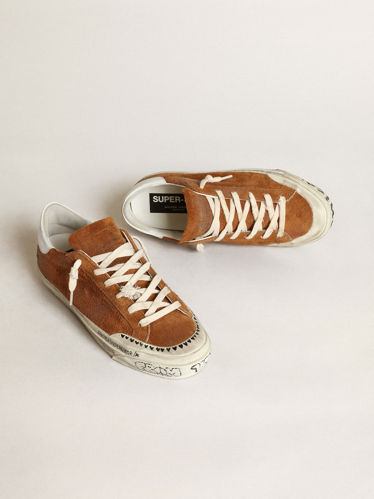 Golden Goose - Women’s Super-Star LTD in tan suede with a perforated star in 