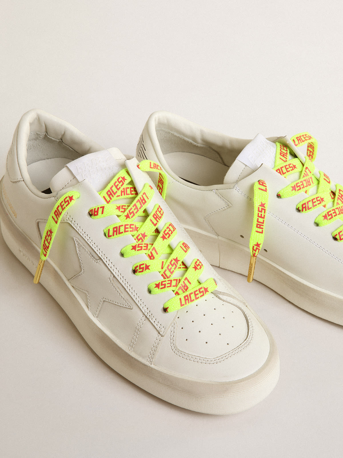 Fluorescent yellow laces with contrasting orange Laces lettering