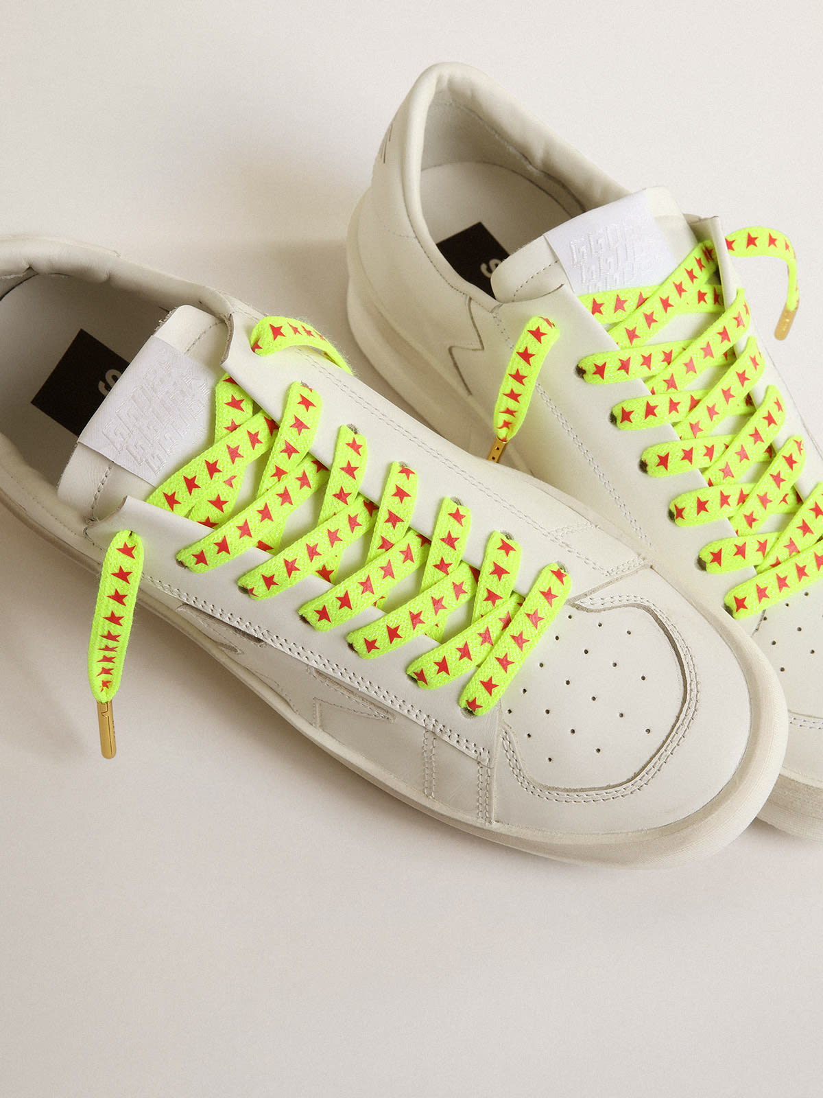 Fluorescent yellow laces with contrasting orange stars