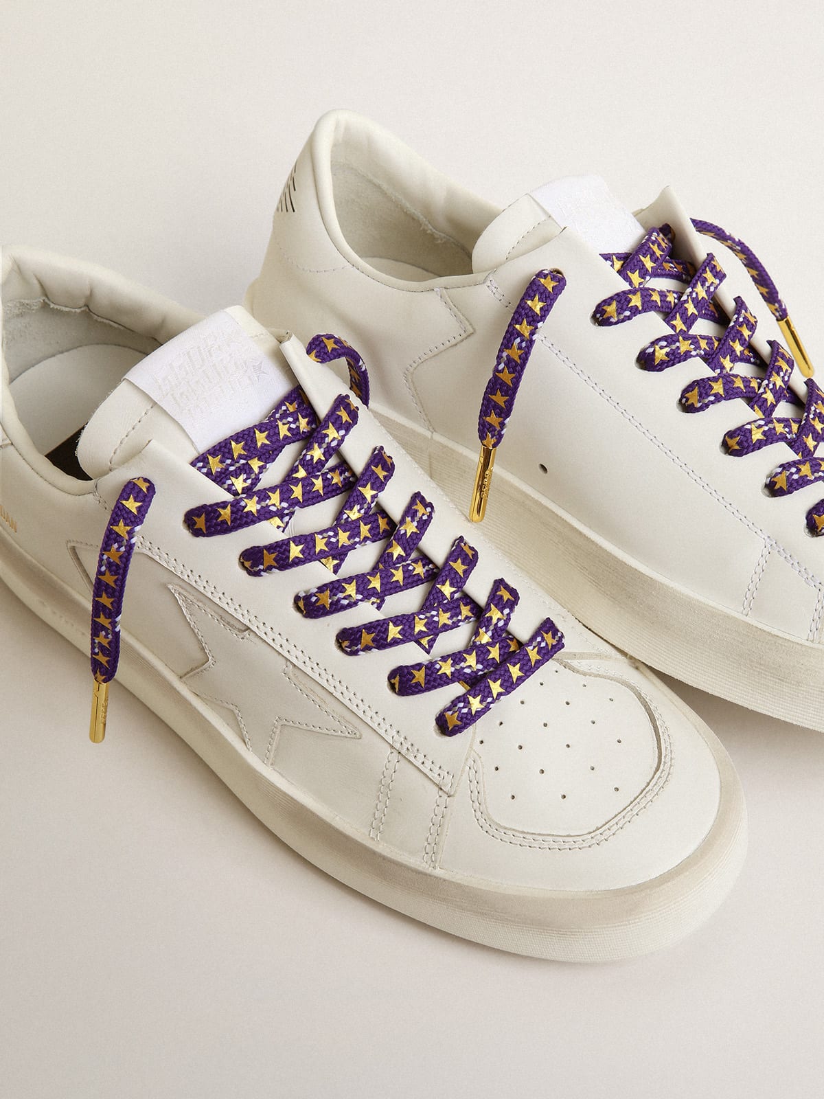 Purple laces with decorations and contrasting gold stars | Golden Goose