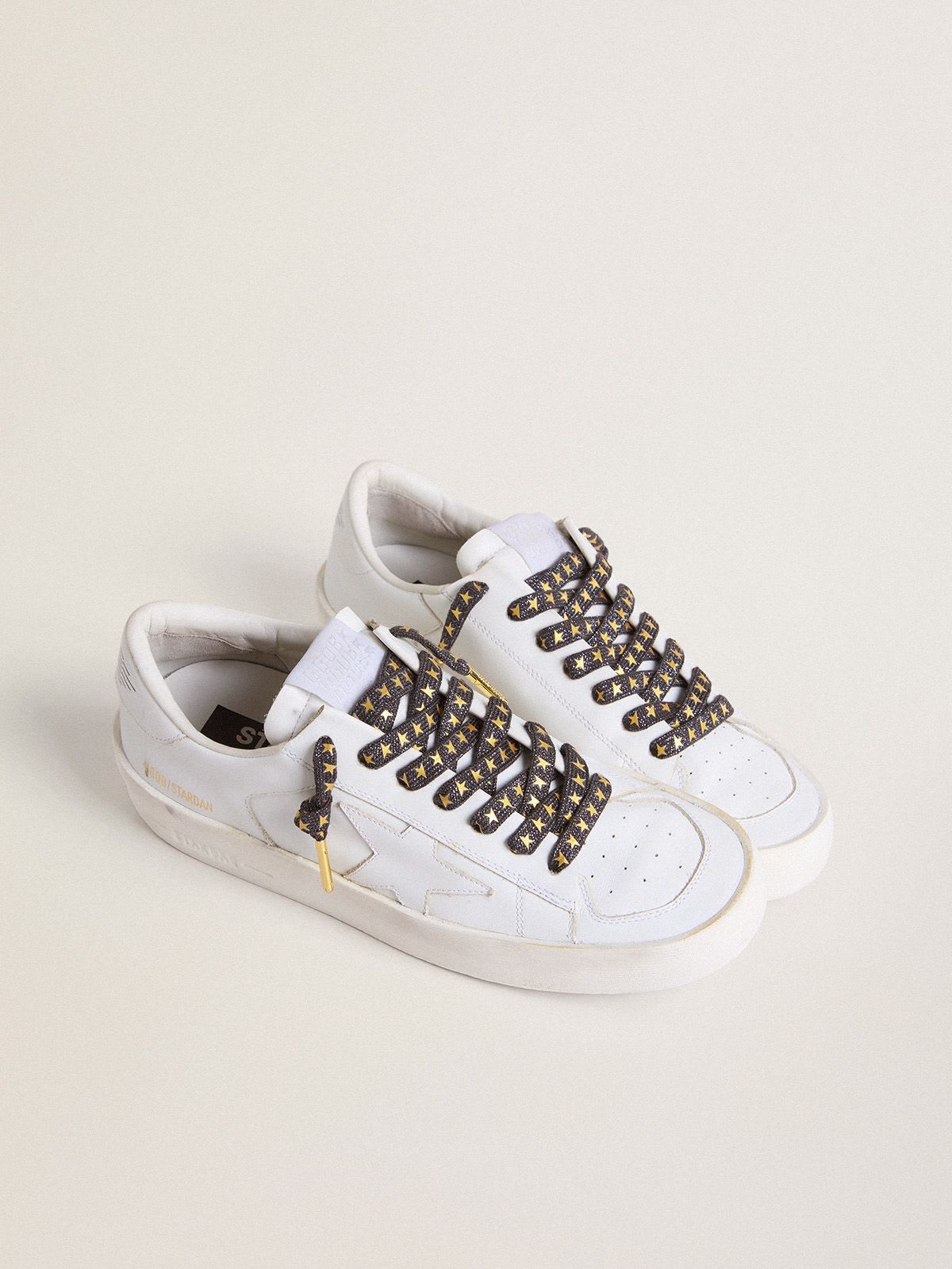 Dark gray Lurex laces with contrasting gold stars