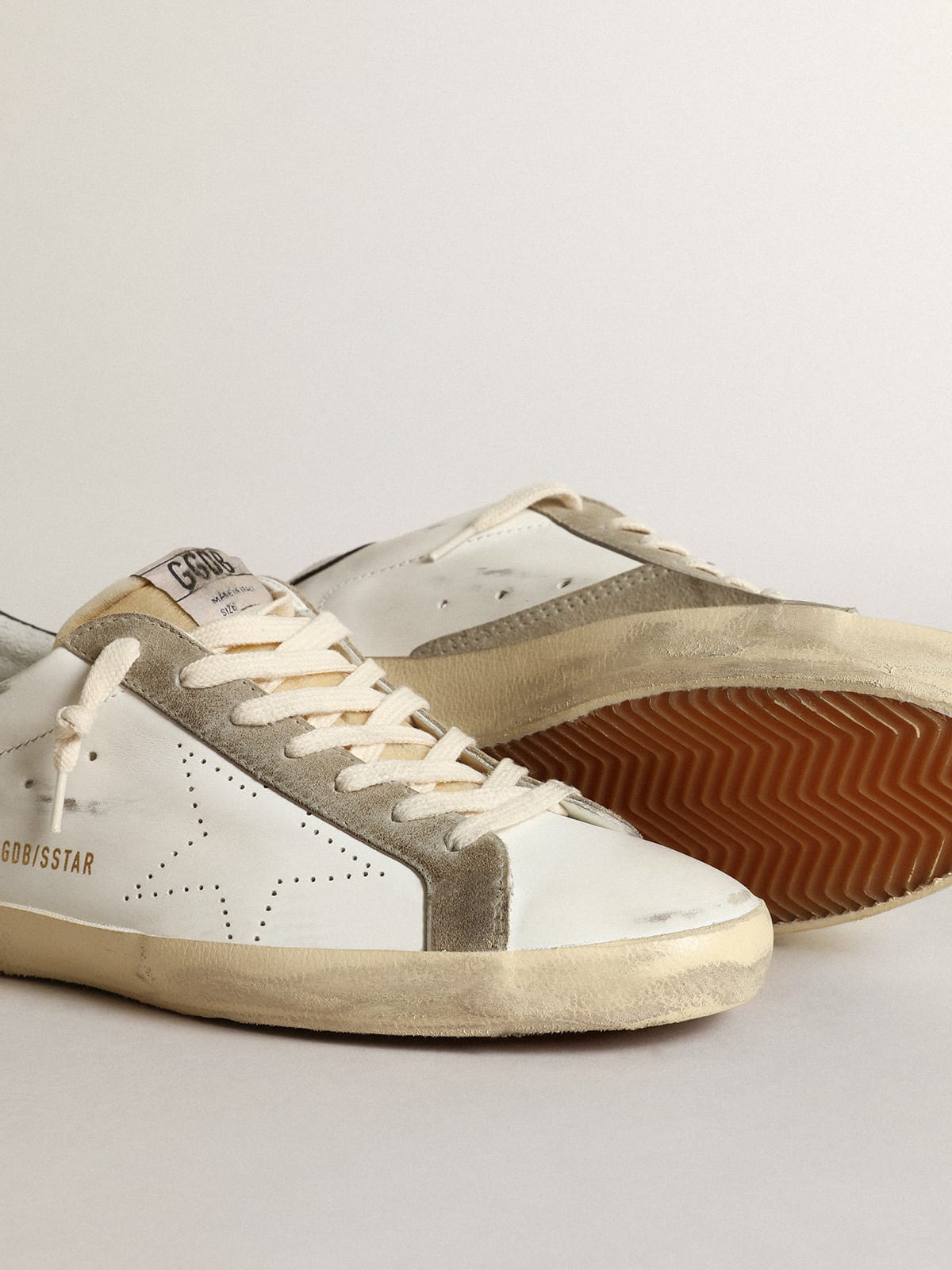 Golden Goose - Men’s Super-Star sneakers with perforated star and glossy midnight-blue leather heel tab in 