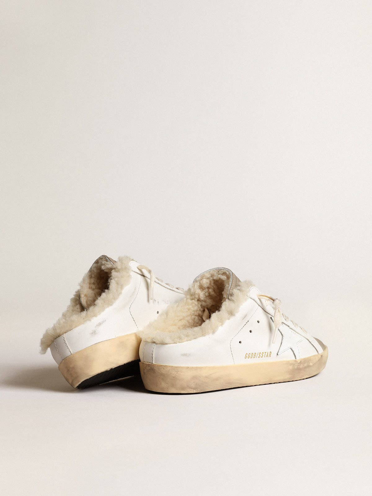 Super-Star Sabots with white leather star and shearling lining