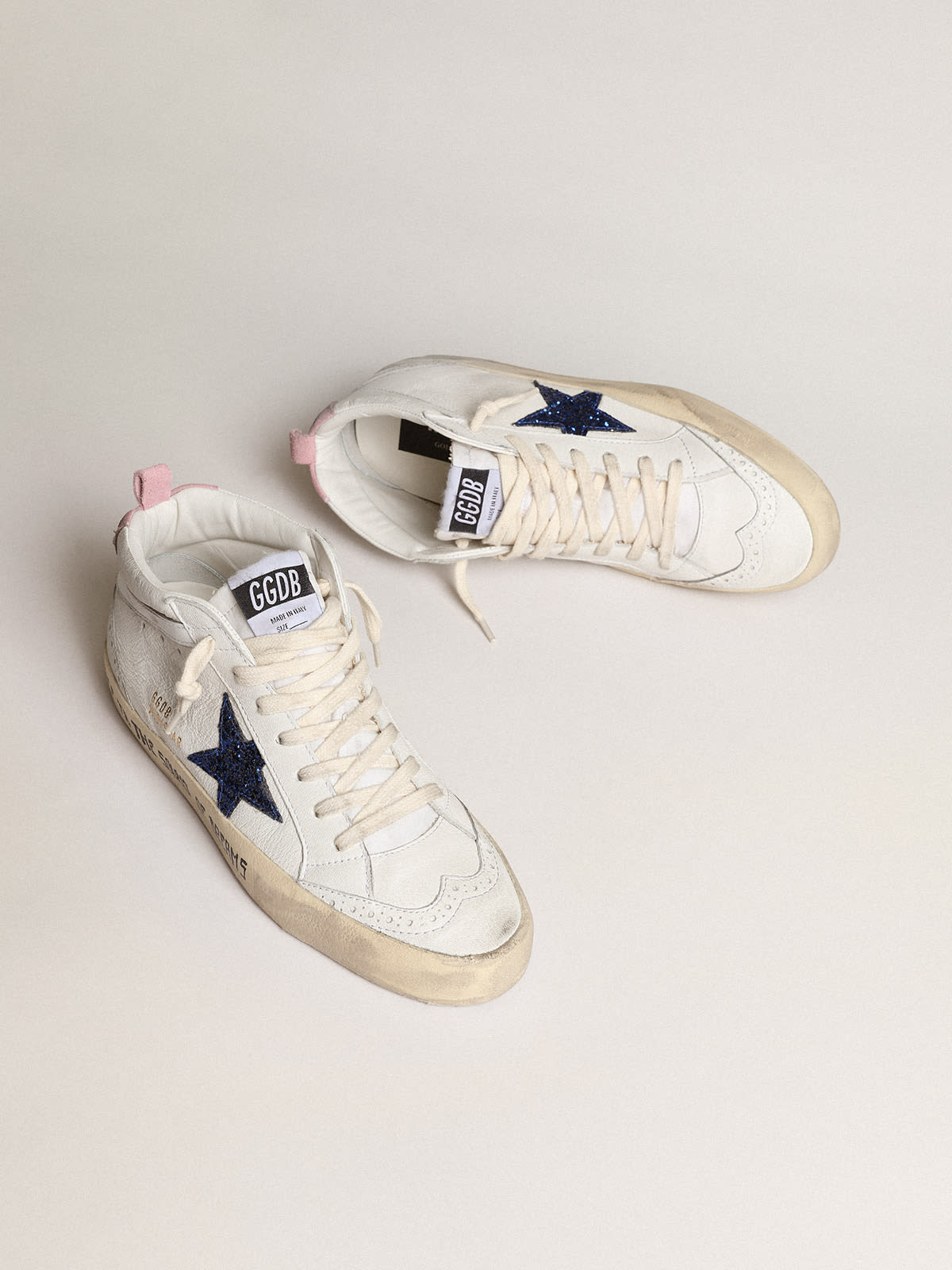 Old School Junior in pink suede with cream leather star and heel tab