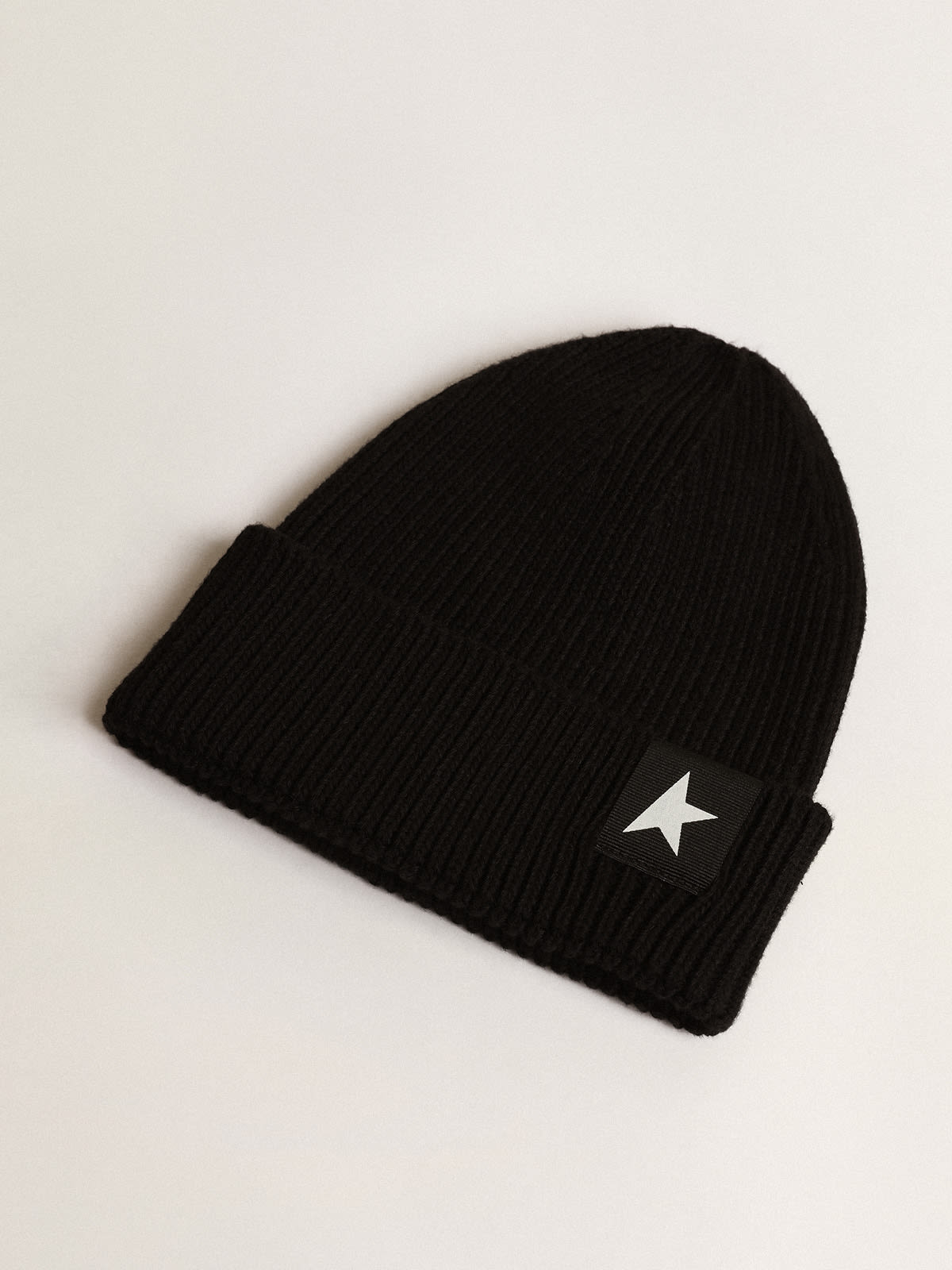 Black cotton beanie with contrasting white star