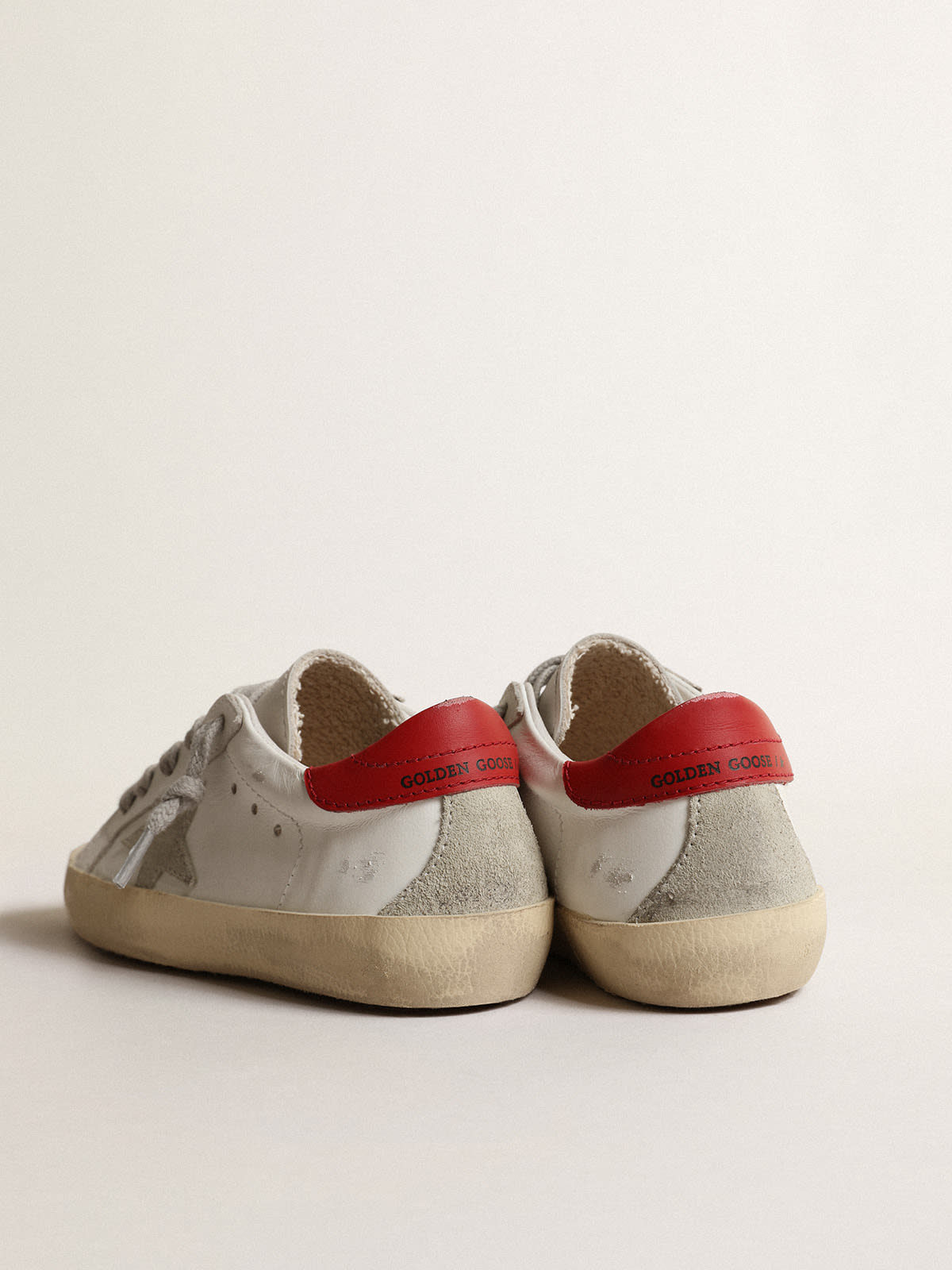 Golden Goose - Super-Star Junior with suede star and red leather heel tab in 