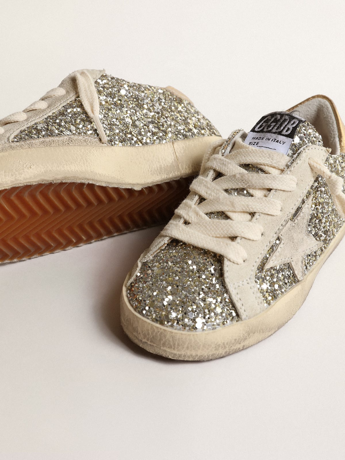 Golden Goose - Super-Star Young in glitter with a suede star and gold heel tab in 