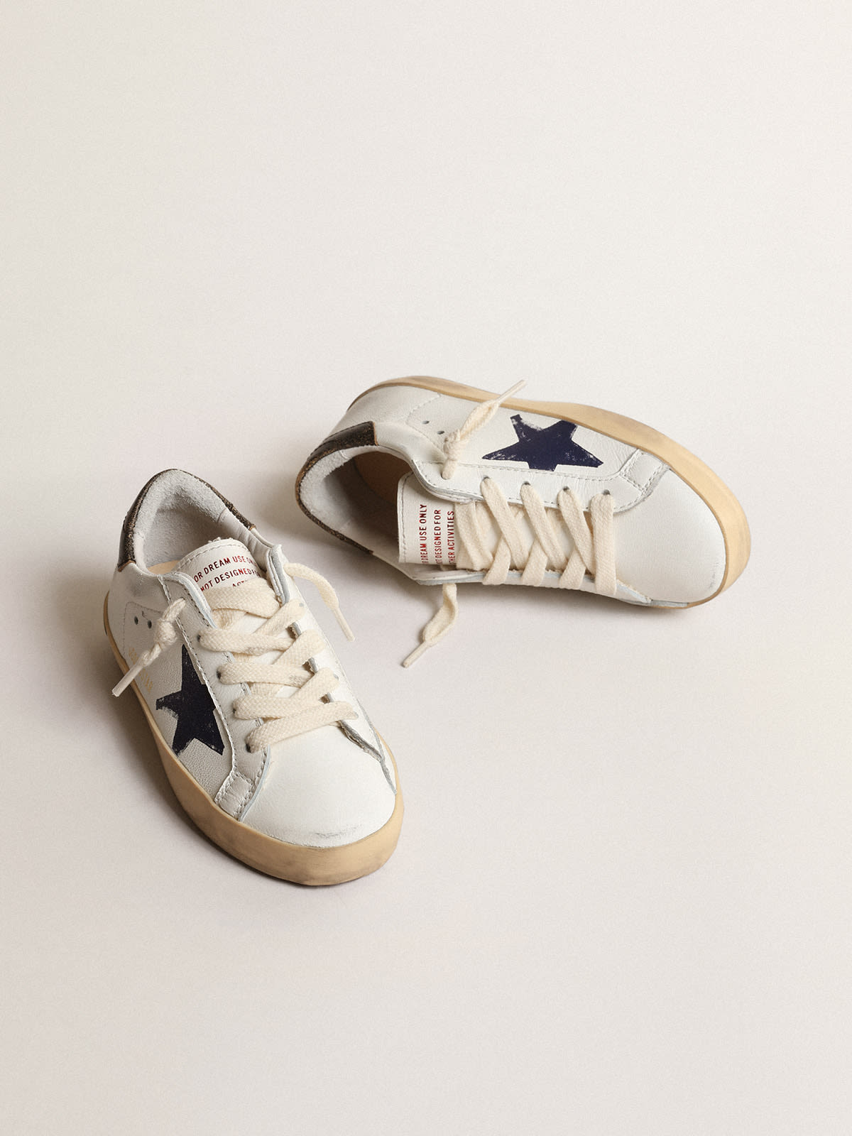 Old School Junior in pink suede with cream leather star and heel tab