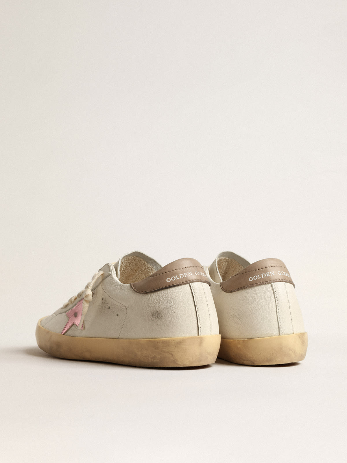 Golden goose superstar leather shop sneakers with metallic back