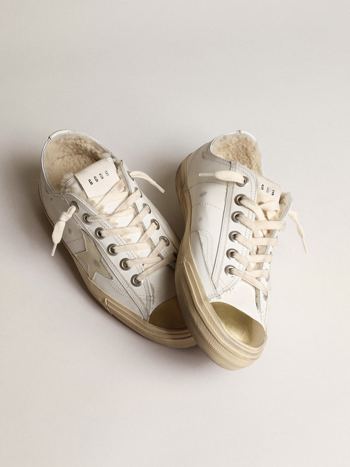 V Star sneakers with leather star and beige shearling lining